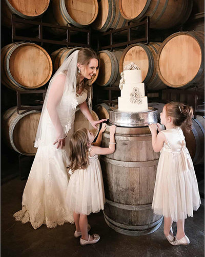Carmel-by-the-sea-bride-cake-with-flower-girls_winery_bride