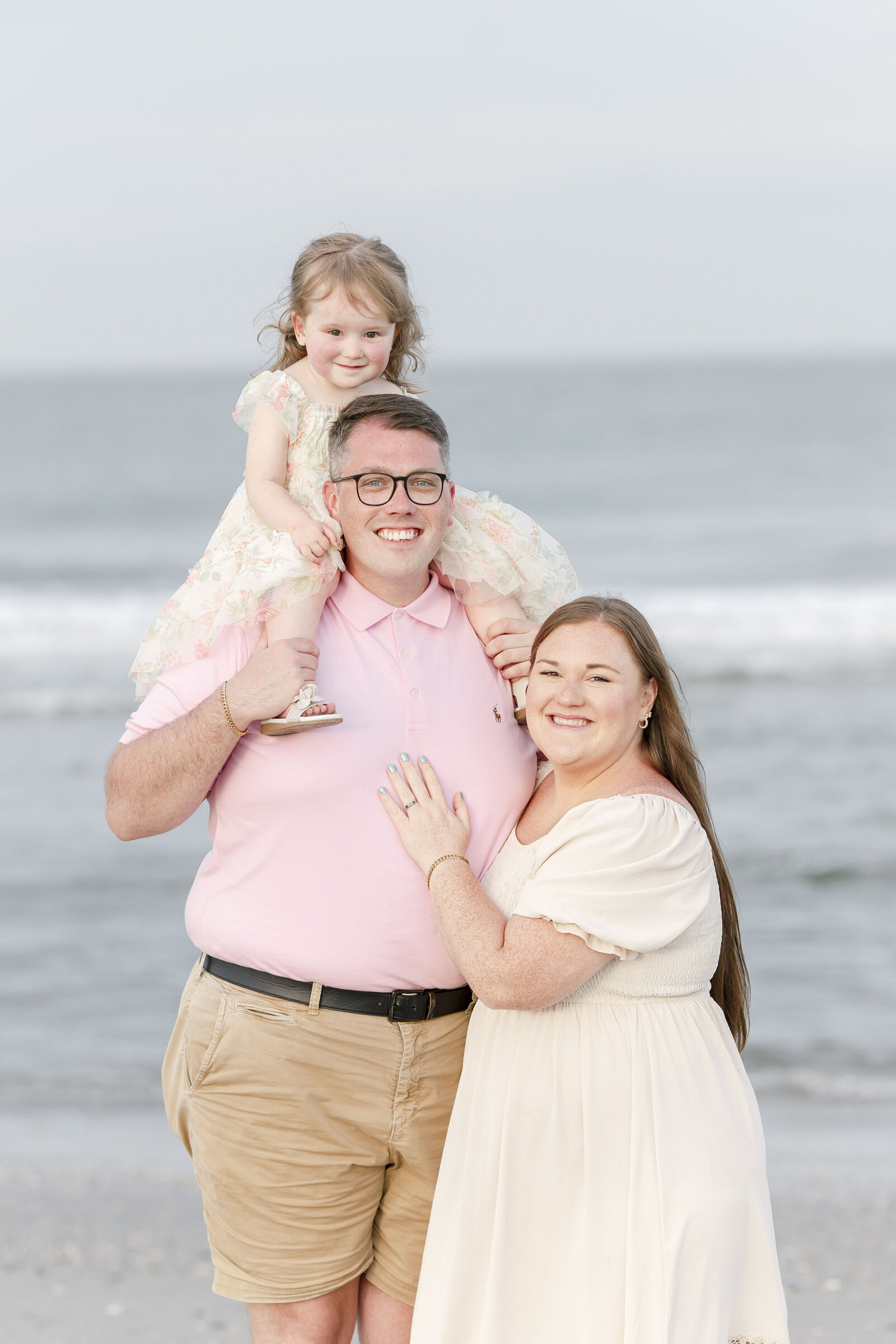 family of three photographed on ocean city new jersey beach