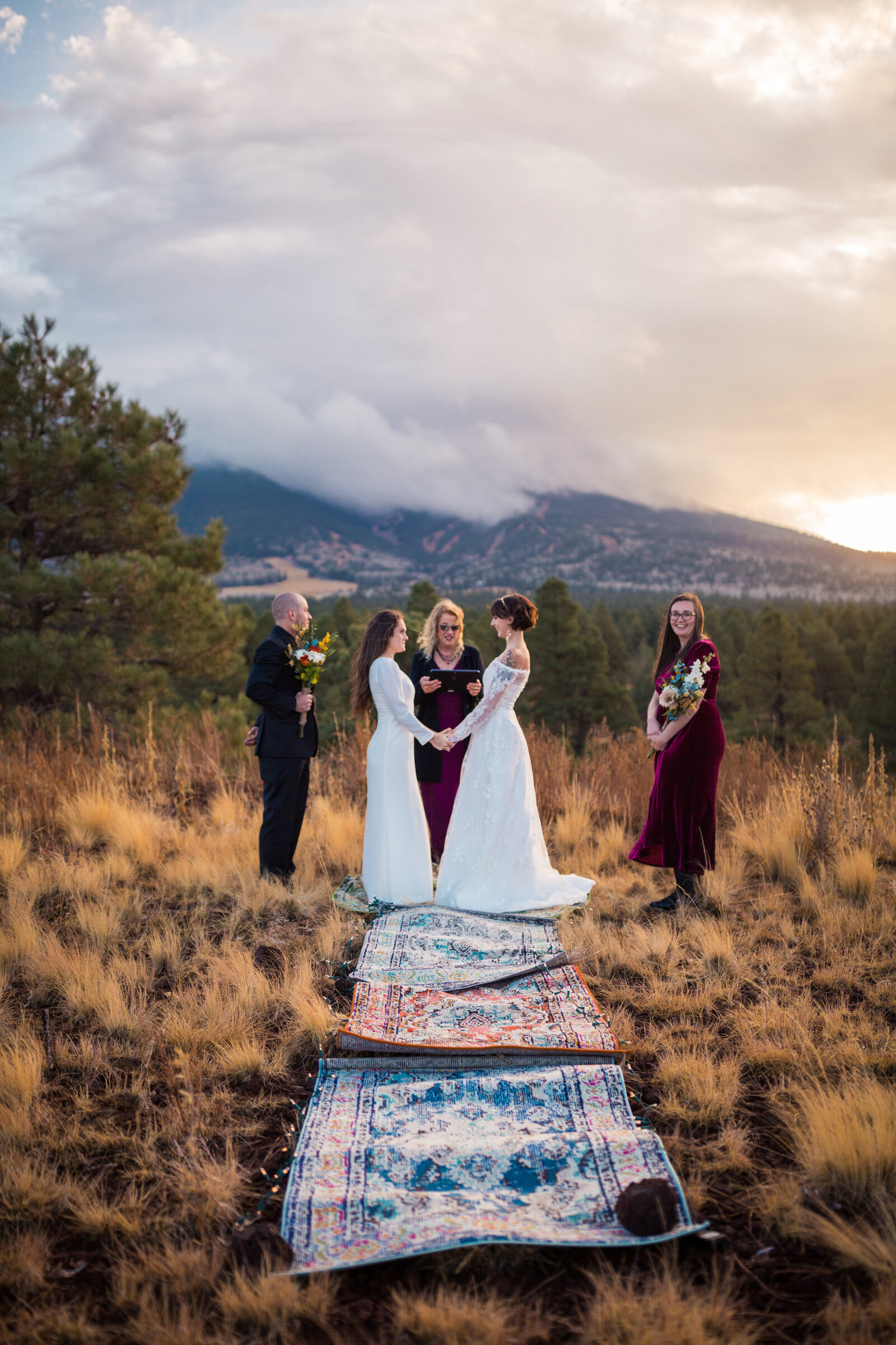 lesbian couple getting married in front of snow bowl in flagstaff