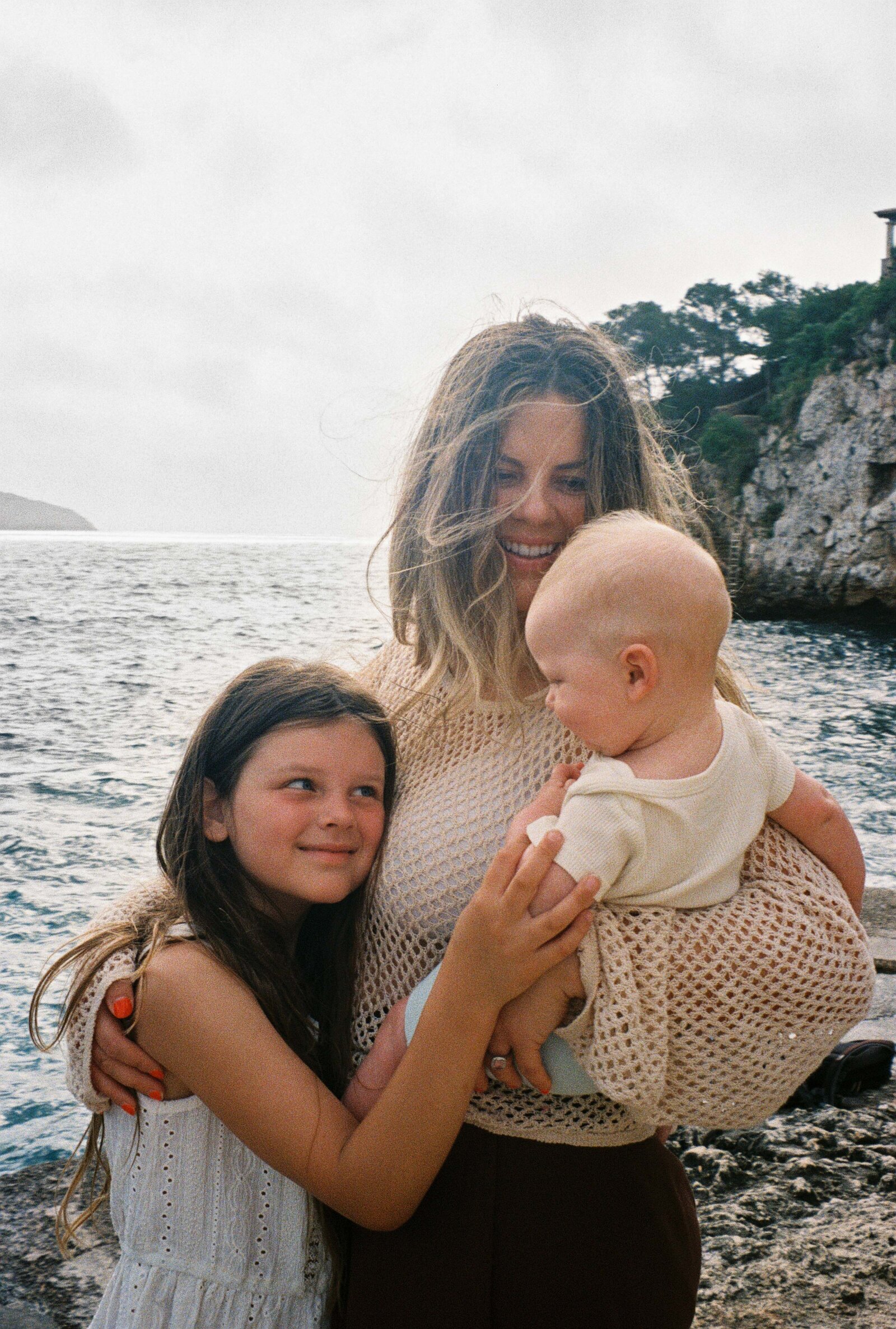 Robyn with her kids on the coast