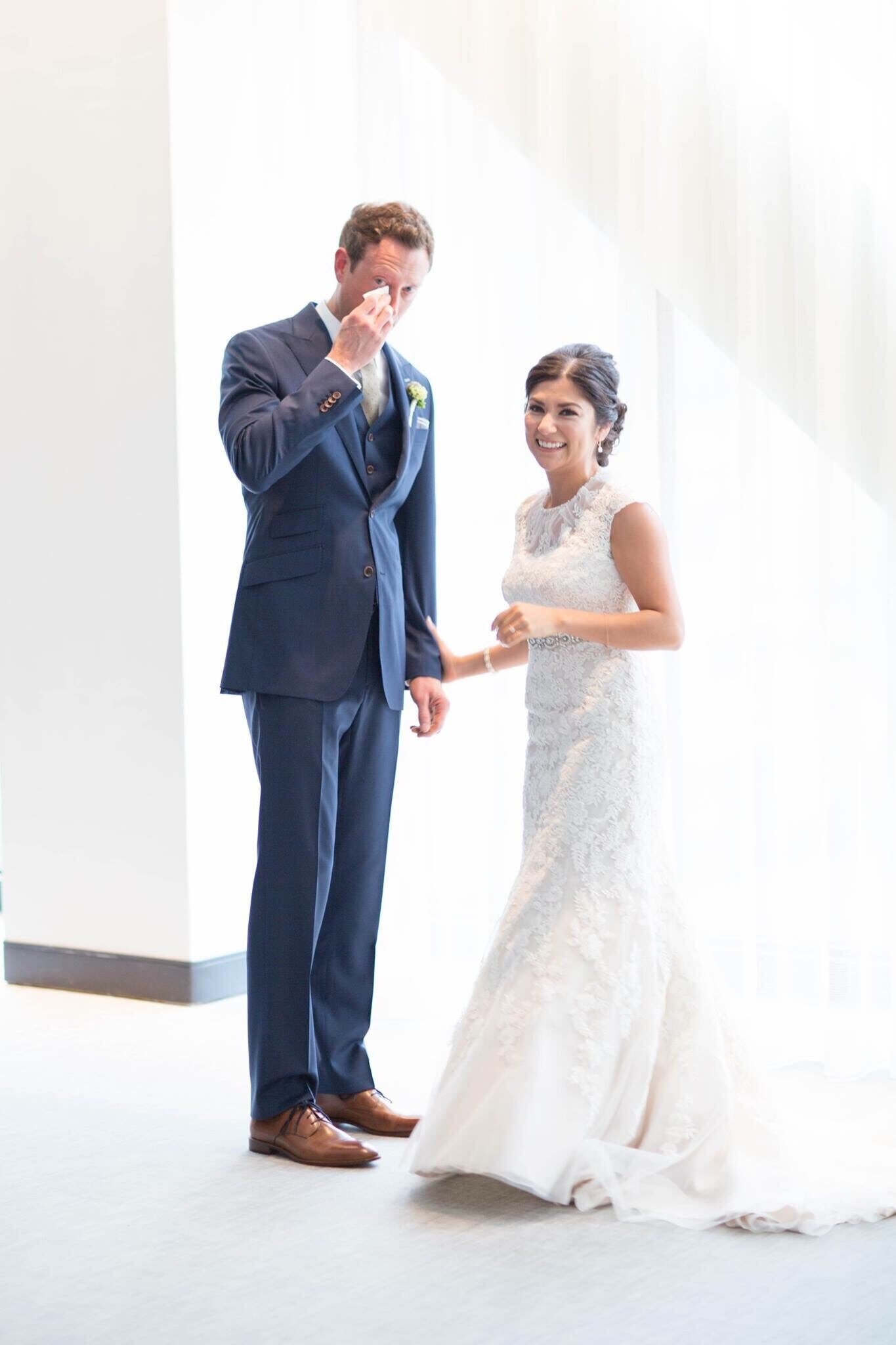 Groom wipes away tears after seeing his beautiful bride for the first time