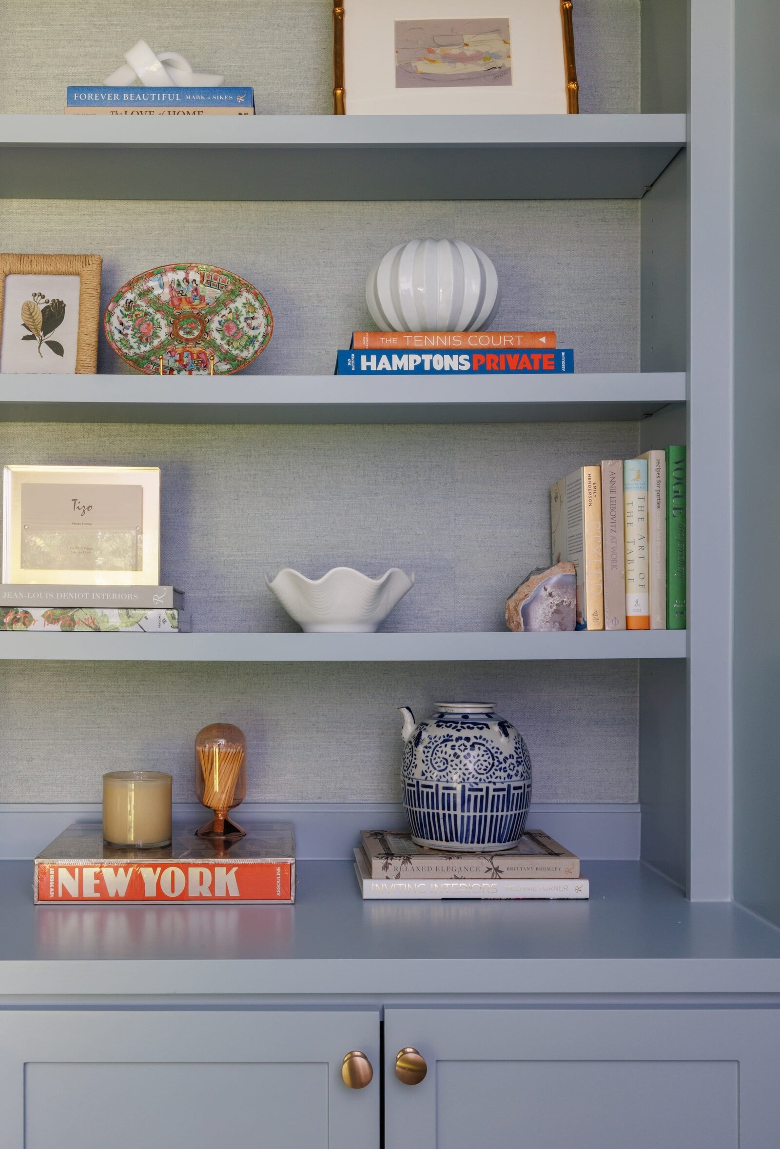 vision and hammer styled shelves on light blue built-in