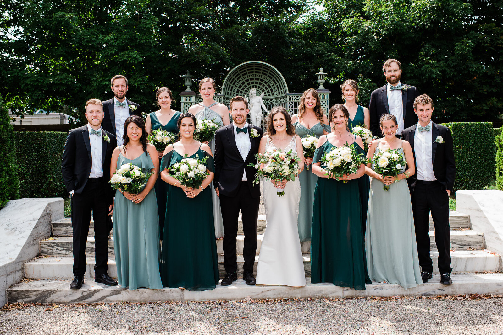 wedding party formal on steps in garden