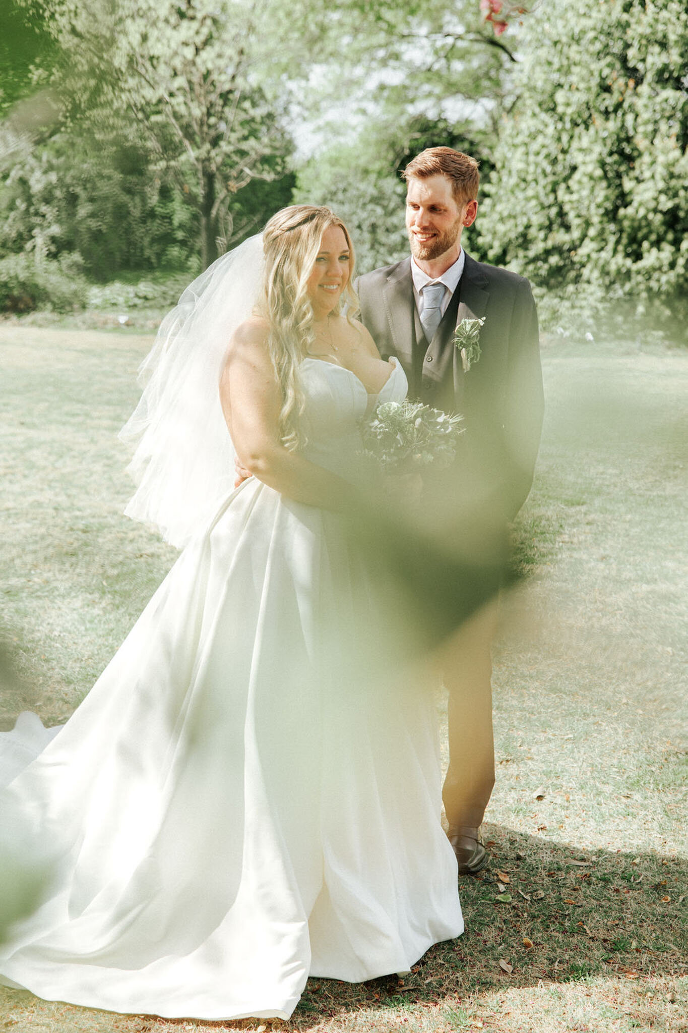 Groom happily facing the bride walking