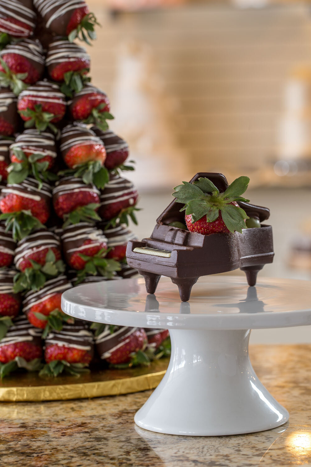 Chocolate piano with a strawberry on top