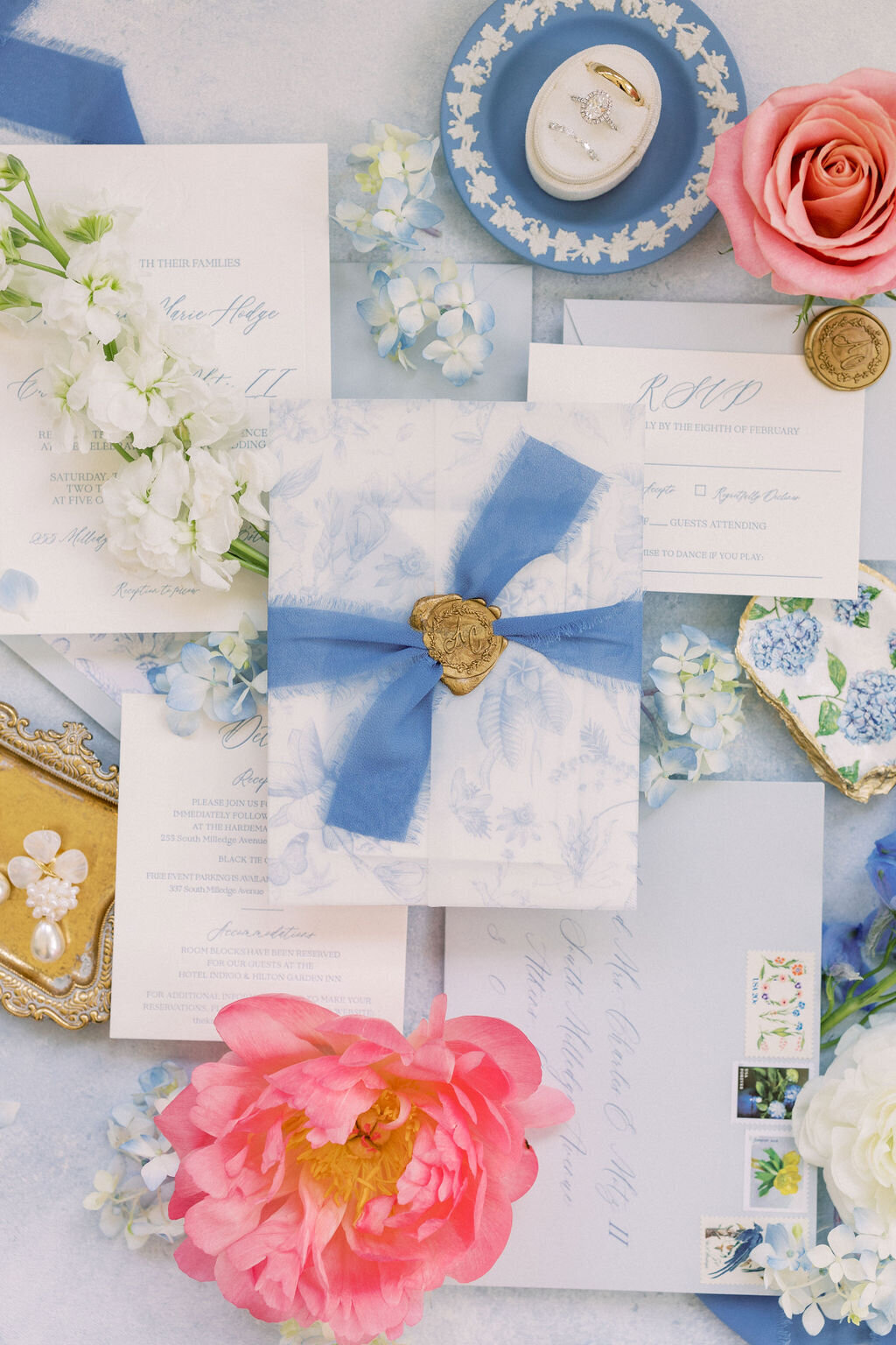 Blue wedding invitations with pink flowers