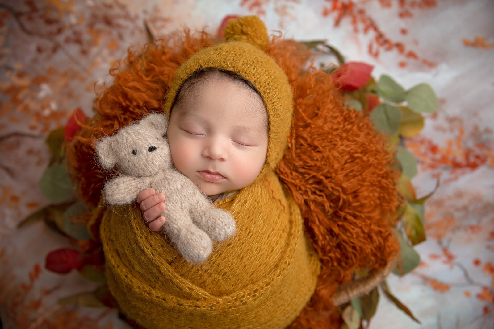 A clean, minimalist portrait of a newborn peacefully sleeping on a soft, neutral backdrop. Expertly styled and photographed in Phoenix, Arizona.