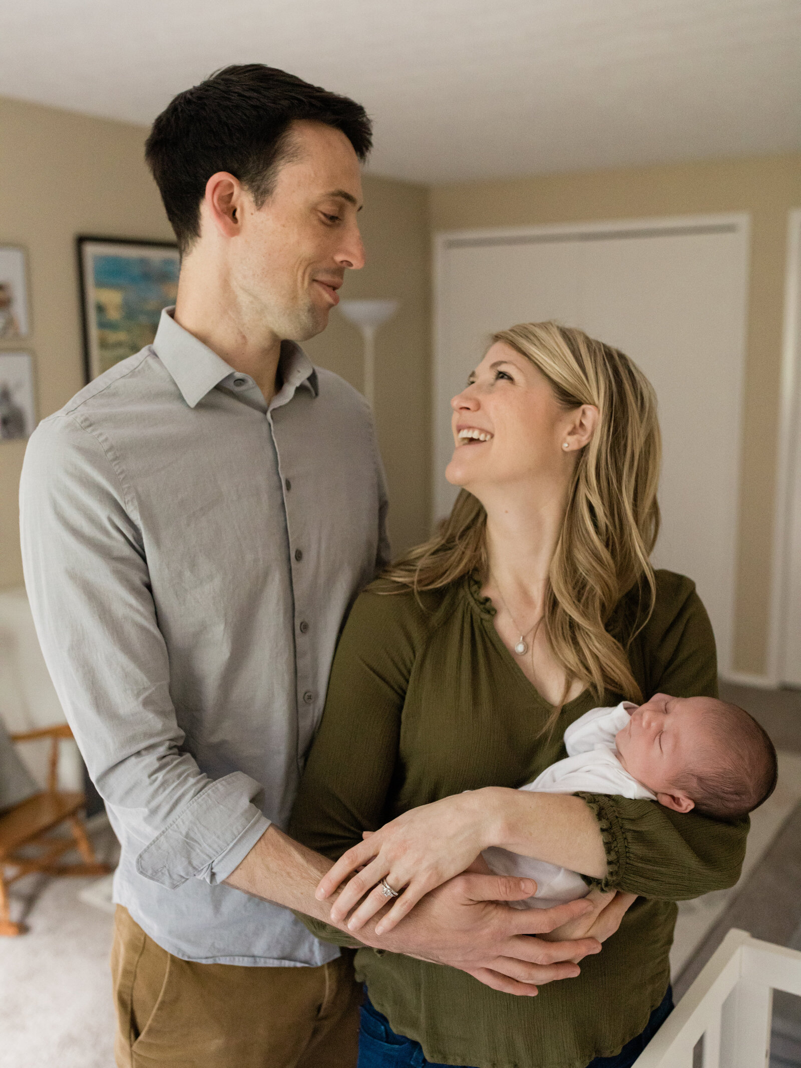 husband and wife holding newborn baby boy cleveland newborn photographer