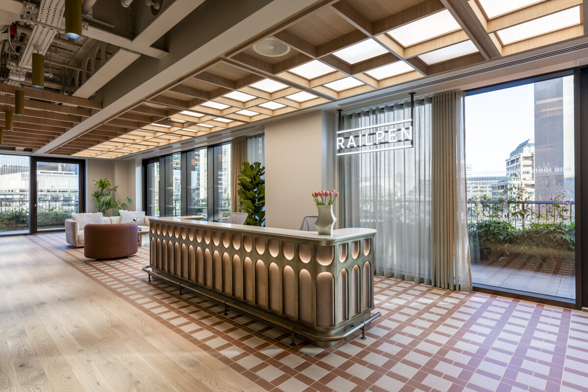 Reception desk interior photos – bespoke joinery with integrated lighting.