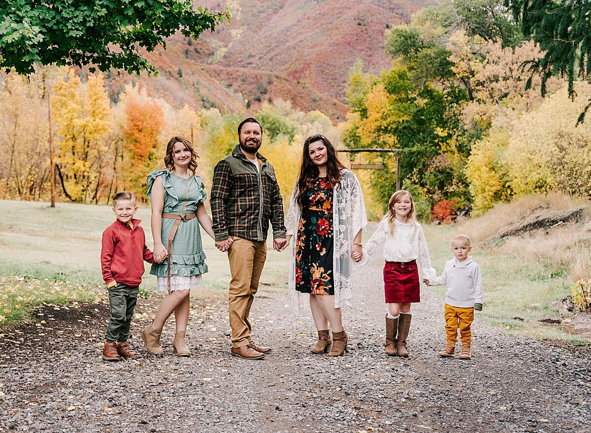 A well dressed family during a fall photoshoot.