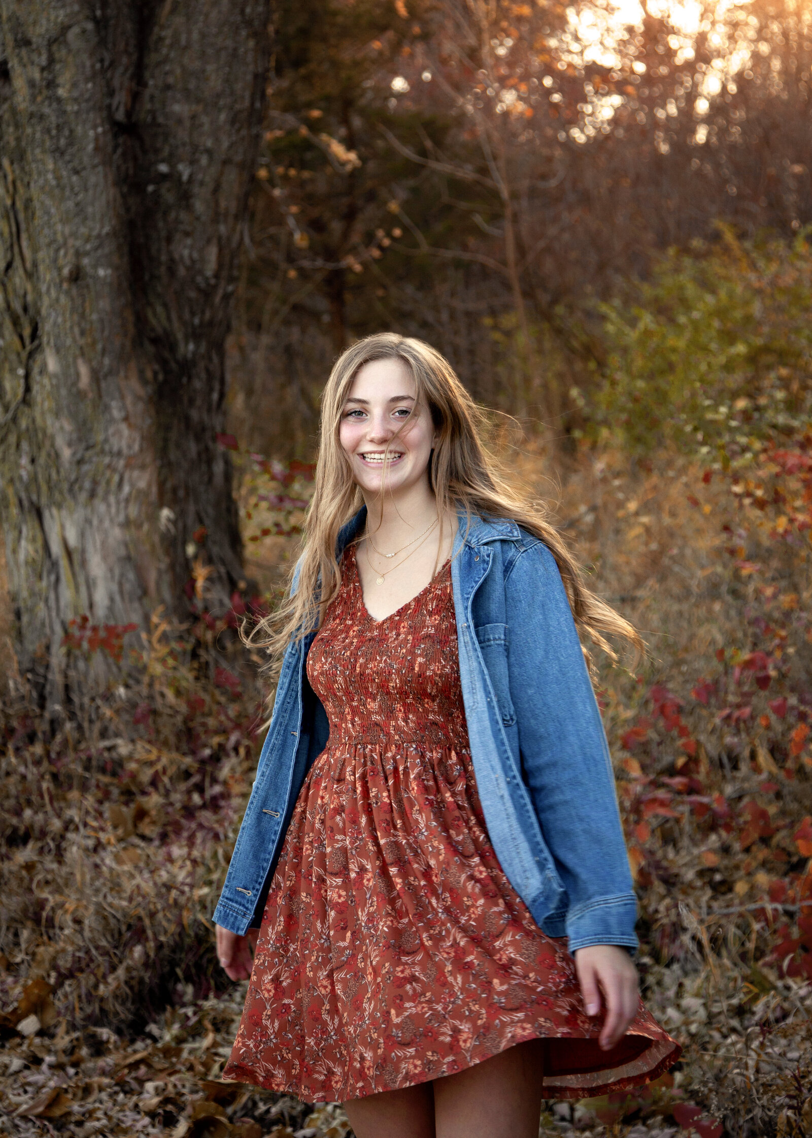 Teen girl spinning dress and smiling. 