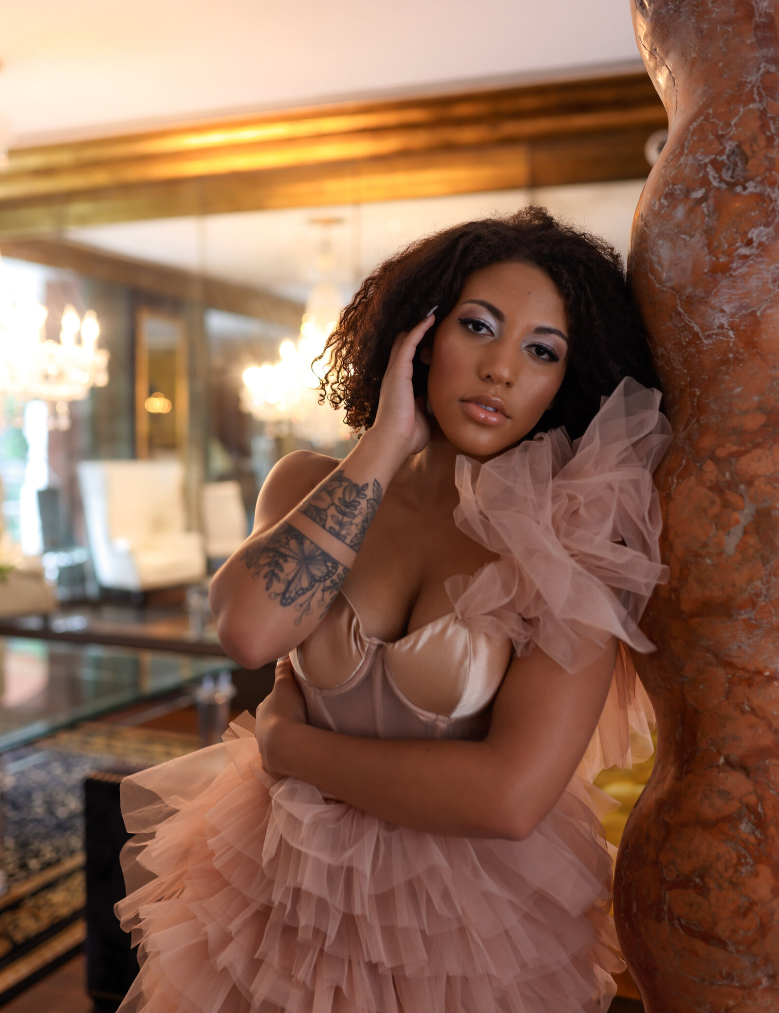 Savannah Boudoir Photography and Glamour showcases gorgeous black woman in pink designer glamour gown in Savannah fancy hotel 3 quarter shot