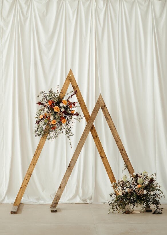 Wedding flowers triangle arch