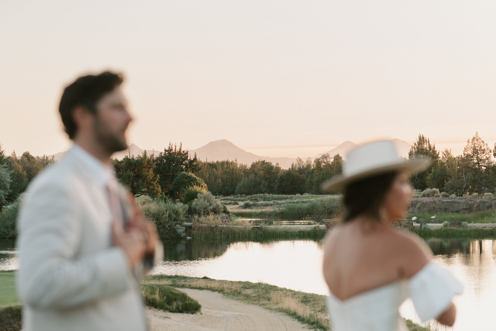 scenic photo of the three sisters mountains in oregon with a bride and groom