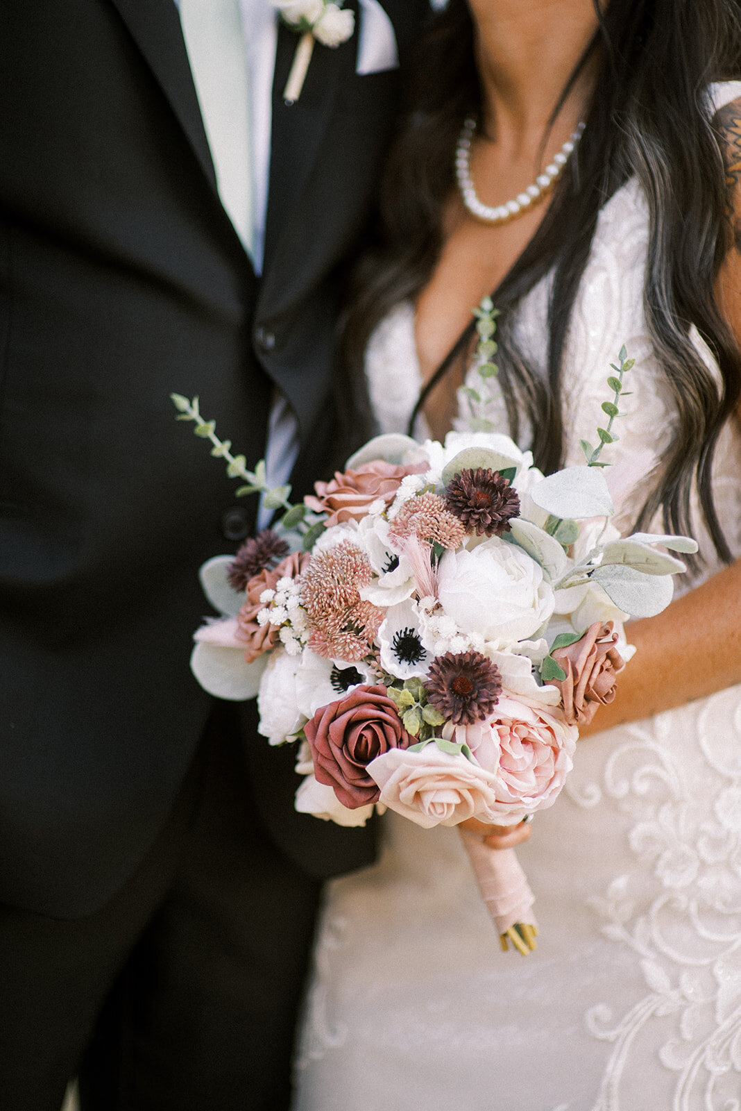 bride holding white bouquet