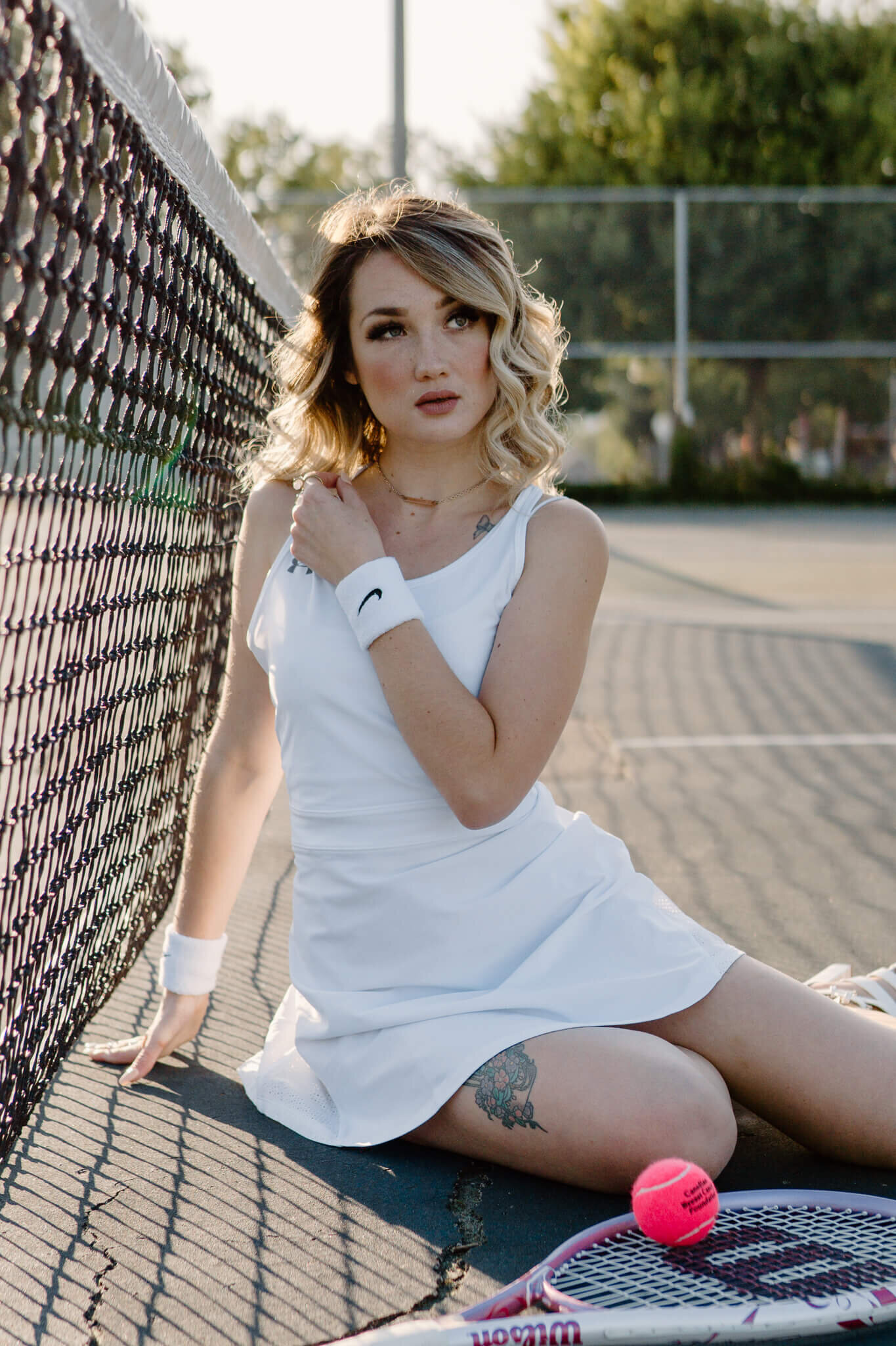 Editorial fashion girl playing tennis photo shoot