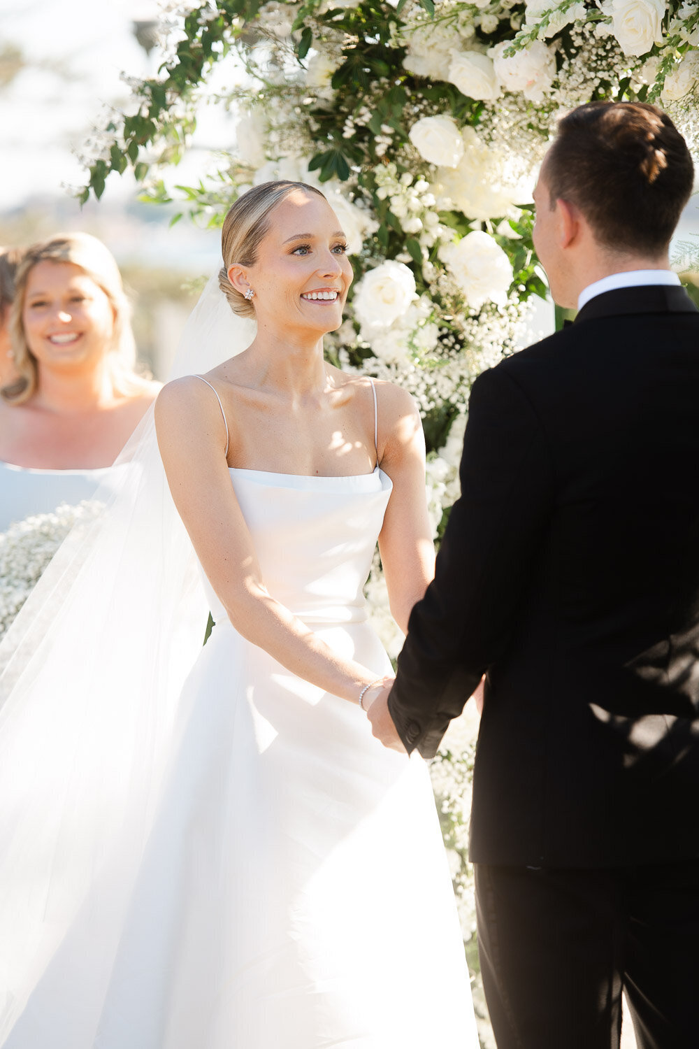 bride gaze at groom at top of aisle