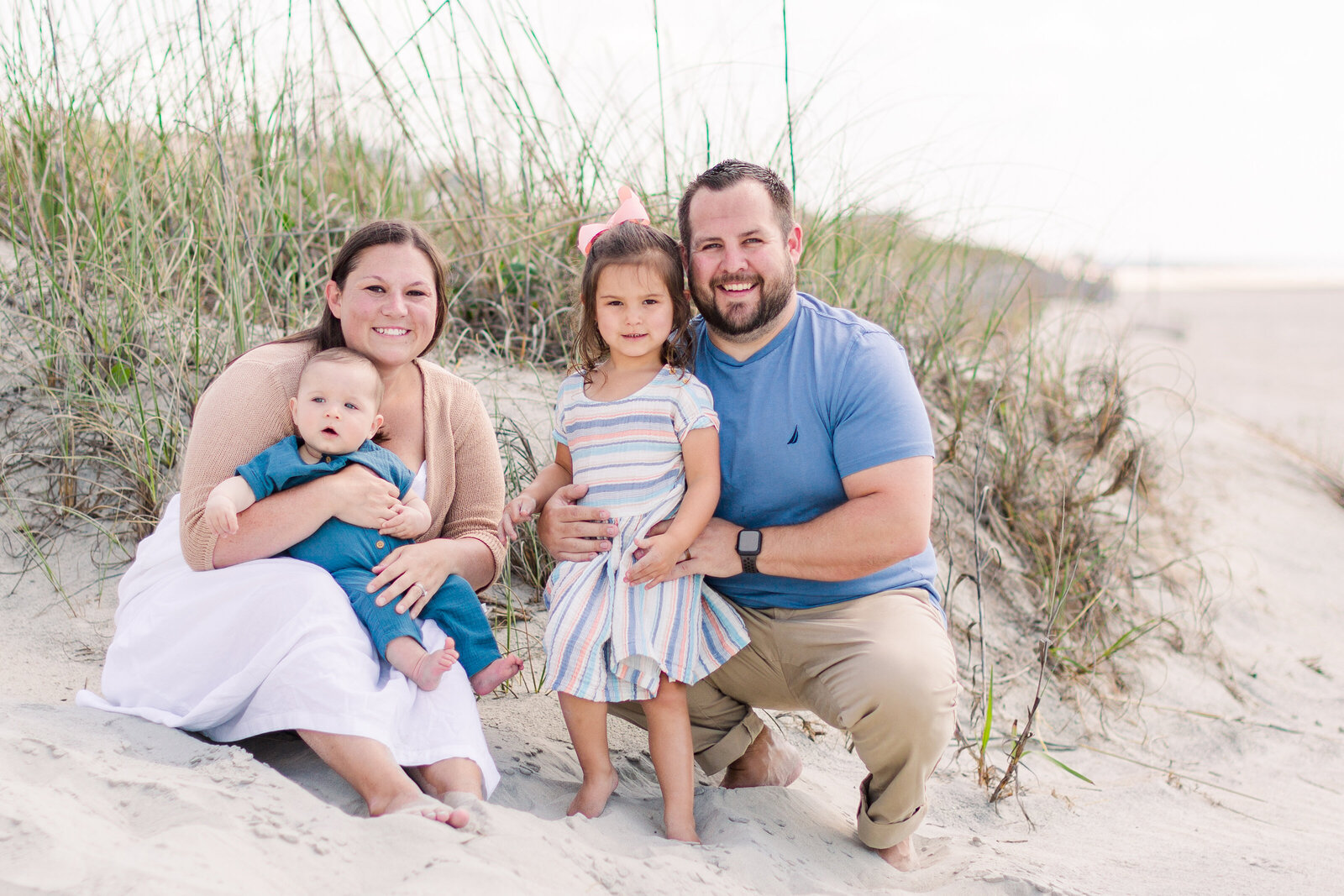 Family photo near the beach dunes at Ocean Isle Beach with Ron Schroll Photography at Ocean Isle Beach, NC