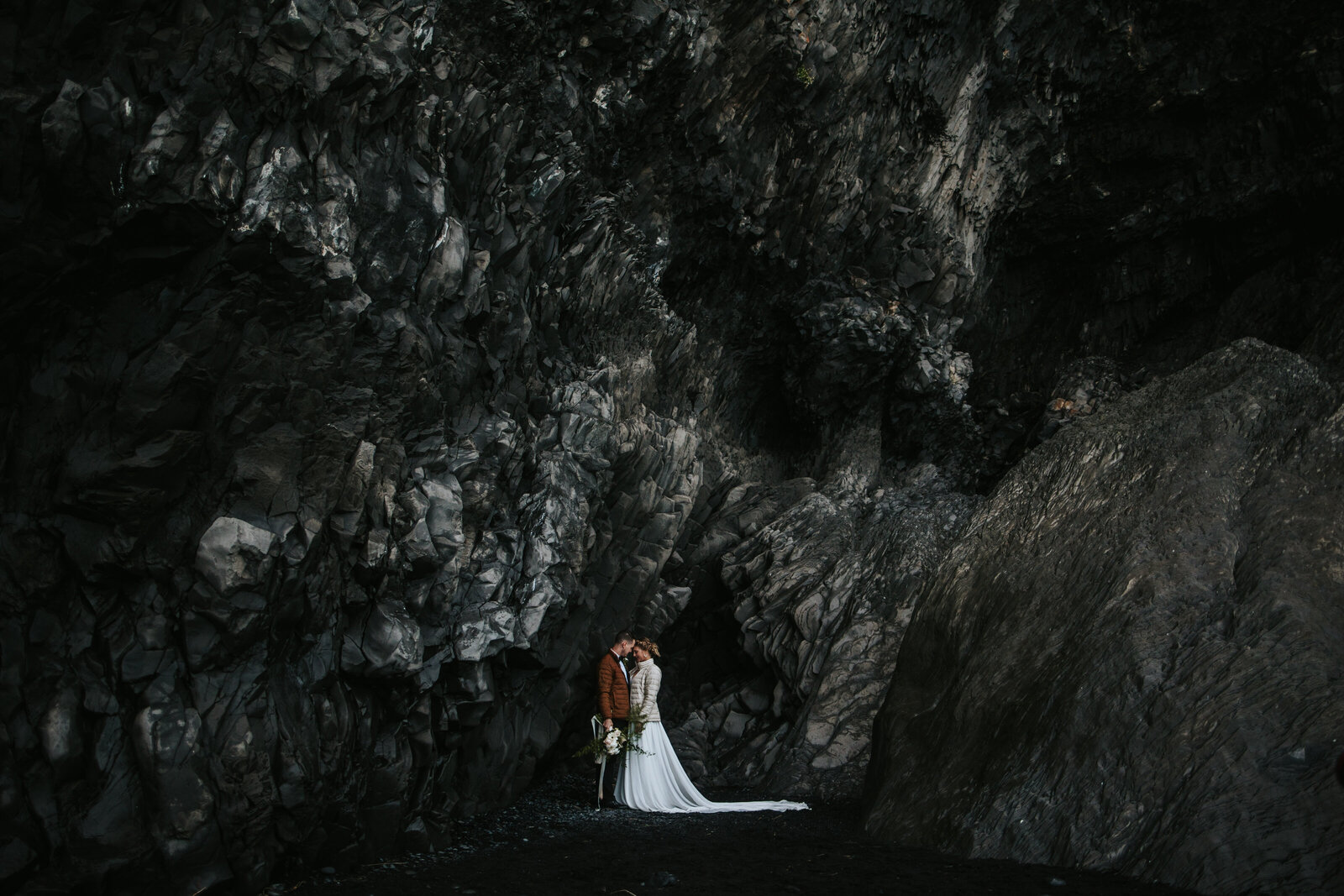 Iceland elopement couple taking in the moment on the black sand beaches.