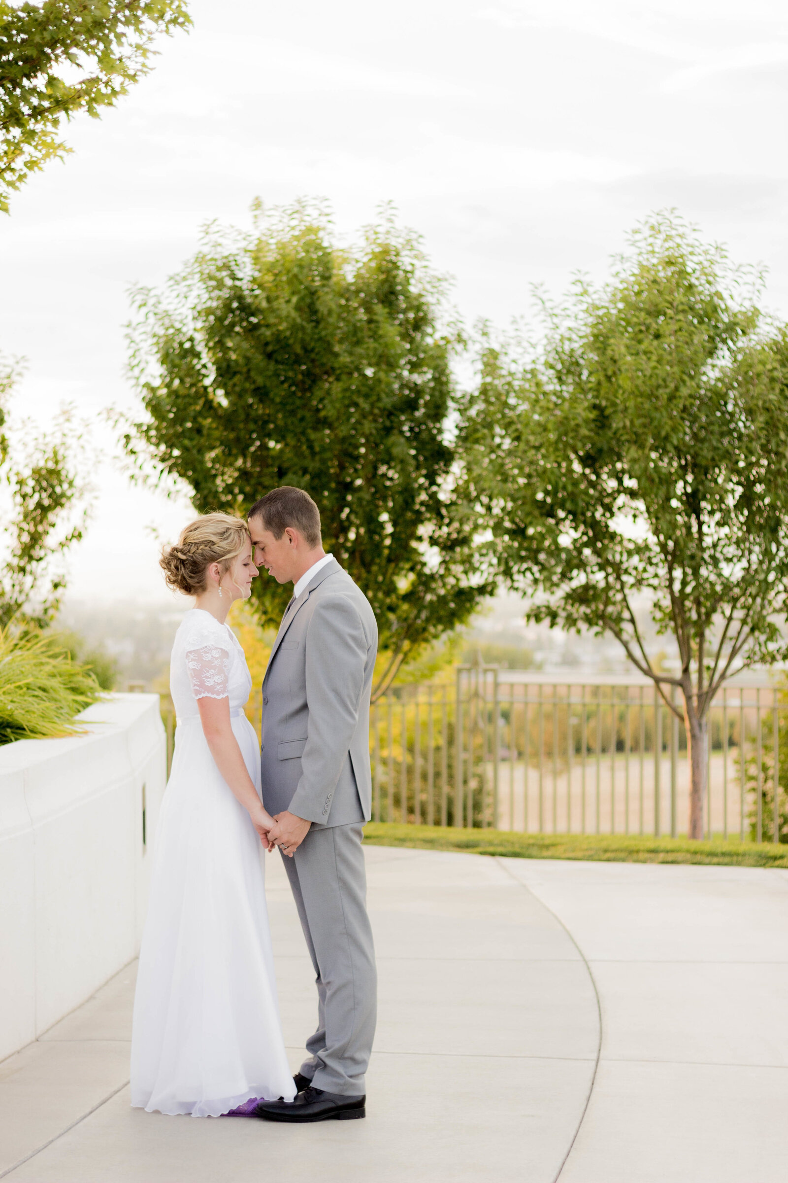 Idaho Wedding Photographers capture Idaho falls Idaho Temple  Photos of bride and groom