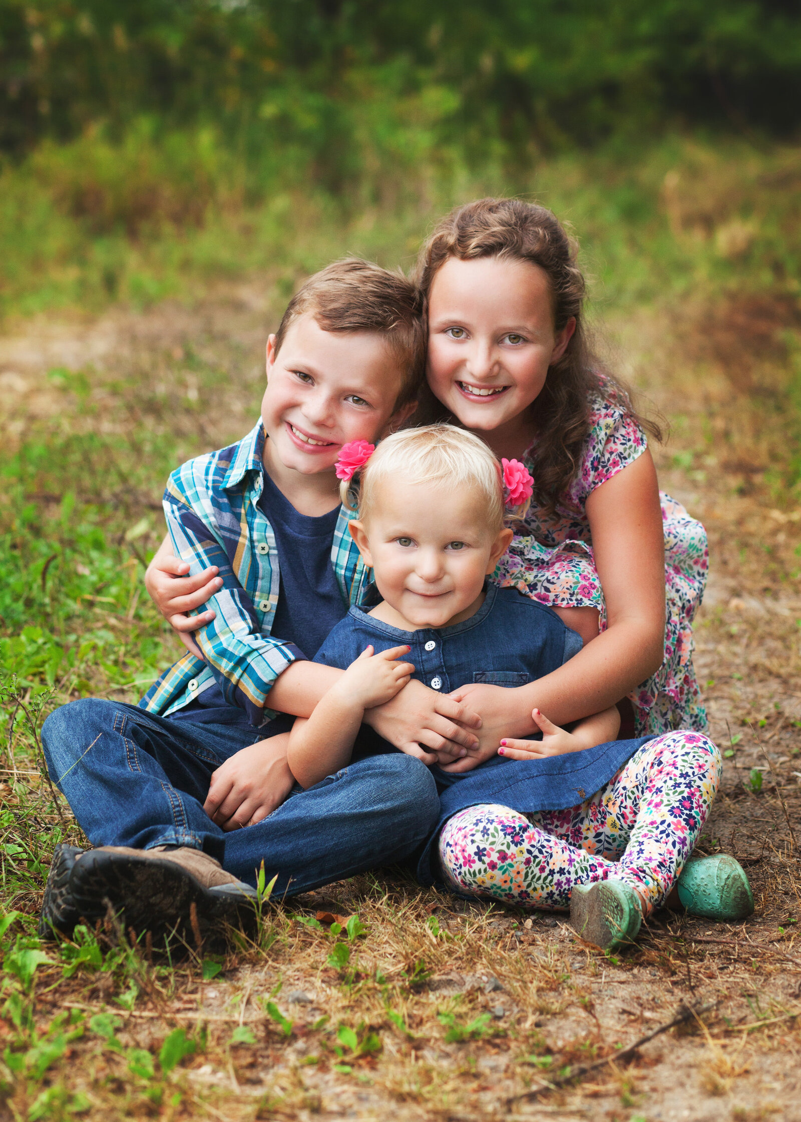 Cute siblings cuddling family session