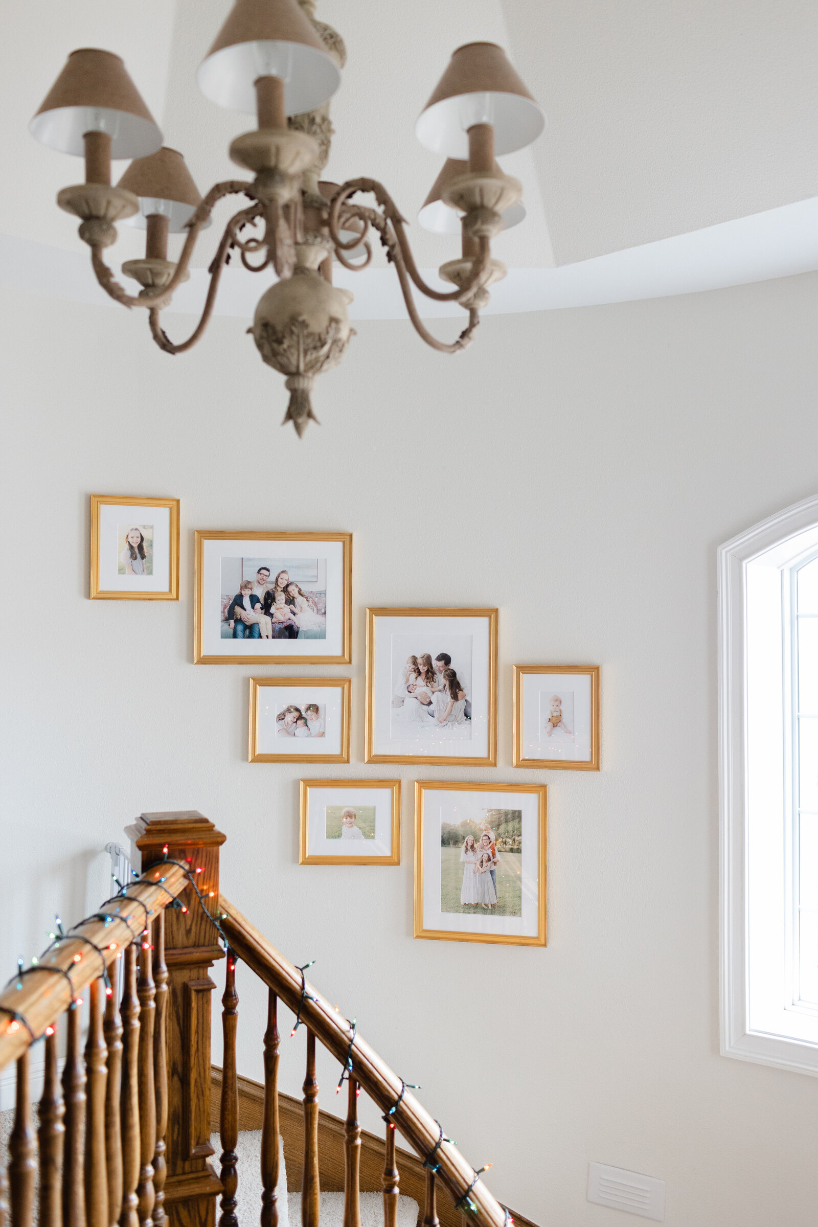 eclectic gold frame gallery wall of family photos