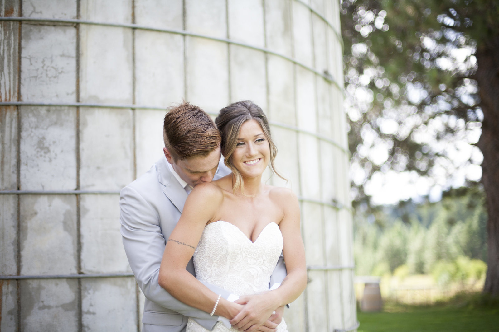 A man and woman embracing on their wedding day in Wenatchee.