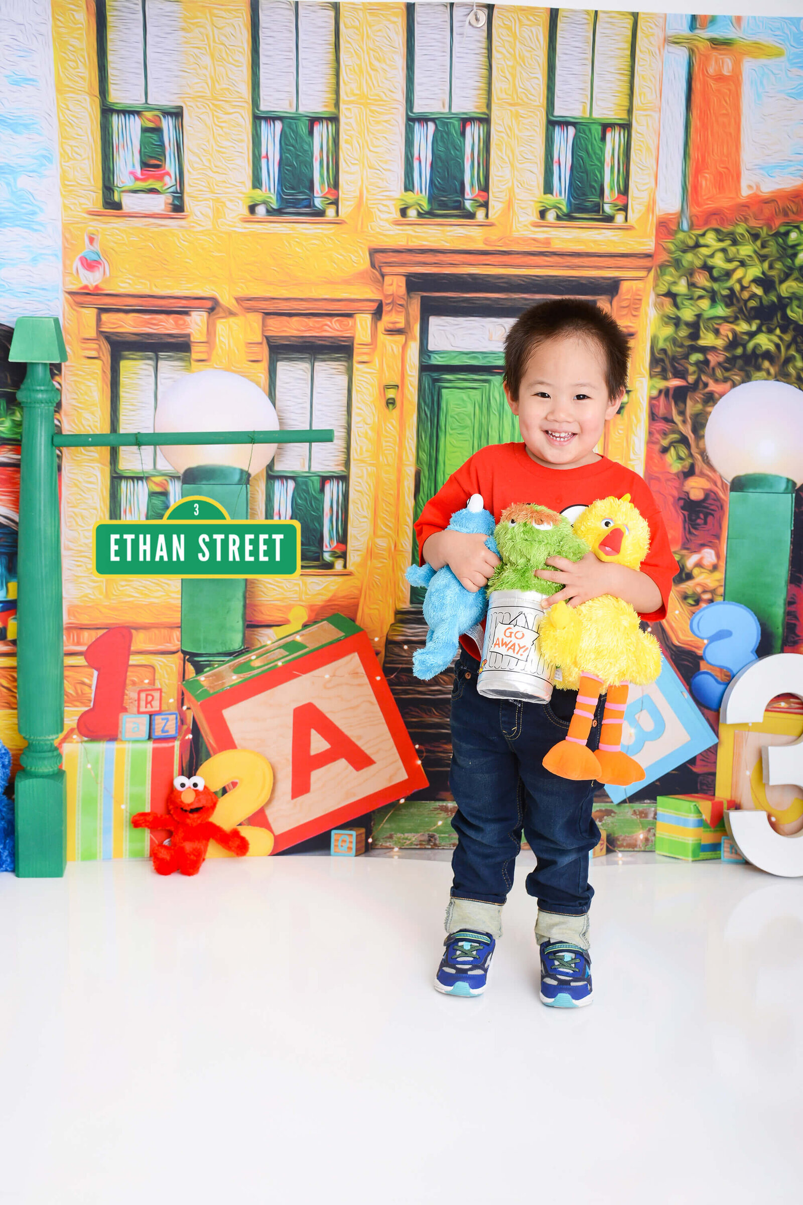 boy smiles at his sesame street session