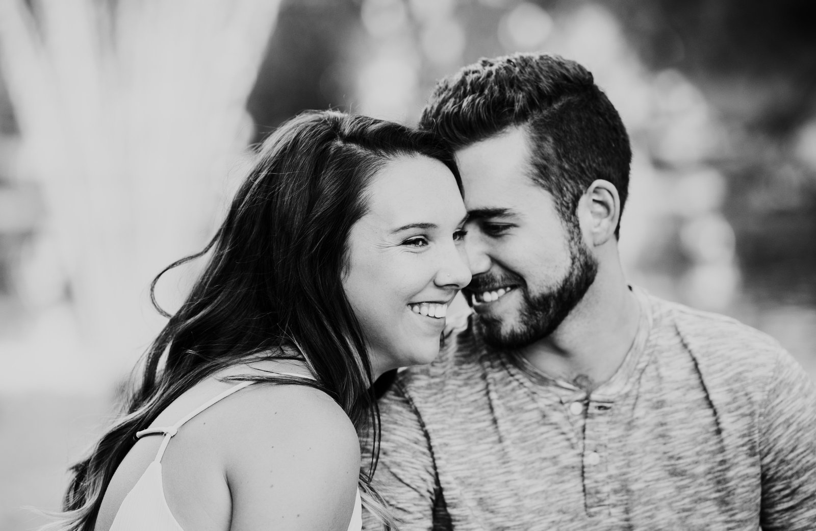 couple kissing each other during engagement photos