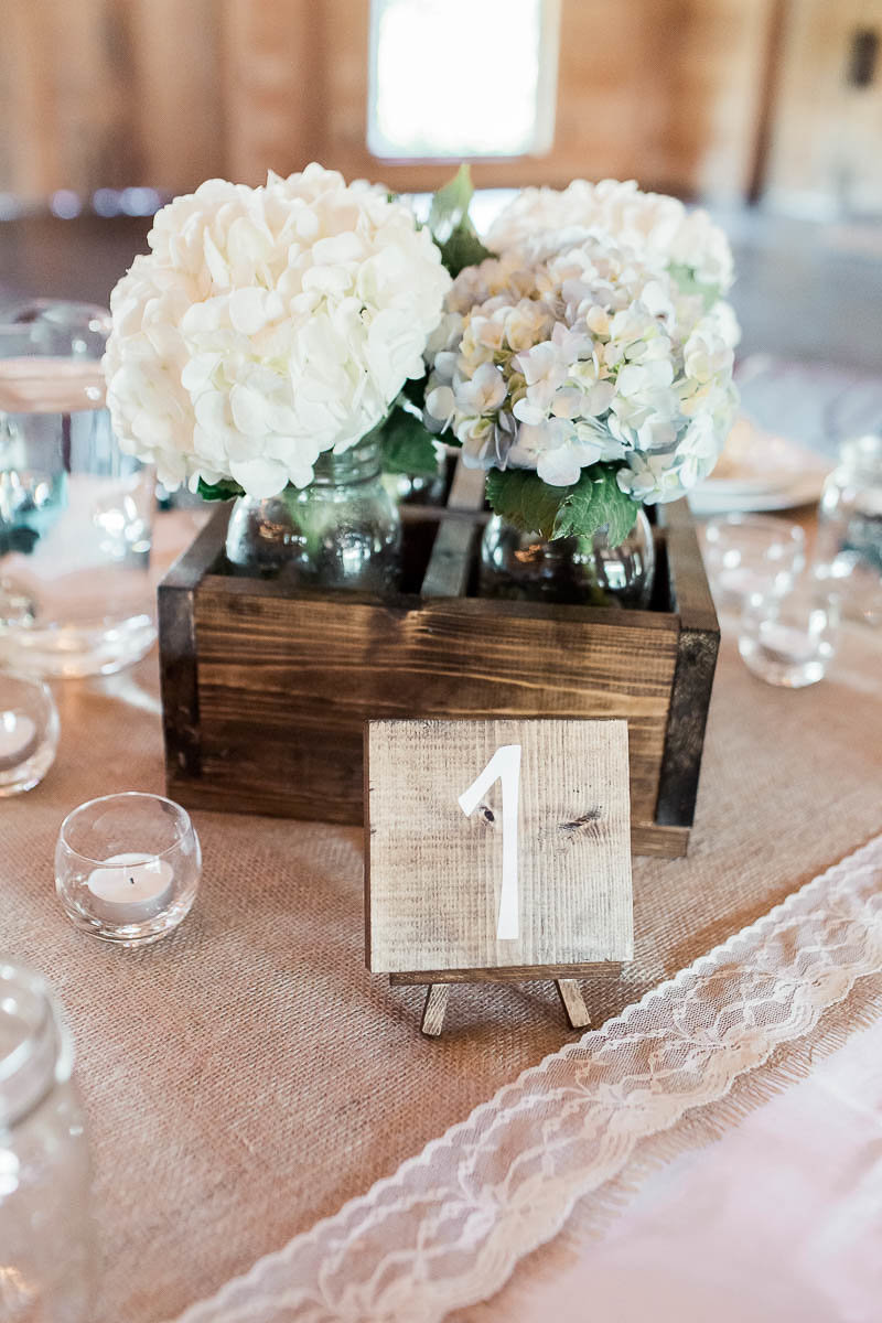 Flowers fill wooden crates as centerpieces, Pepper Plantation, Awendaw, South Carolina