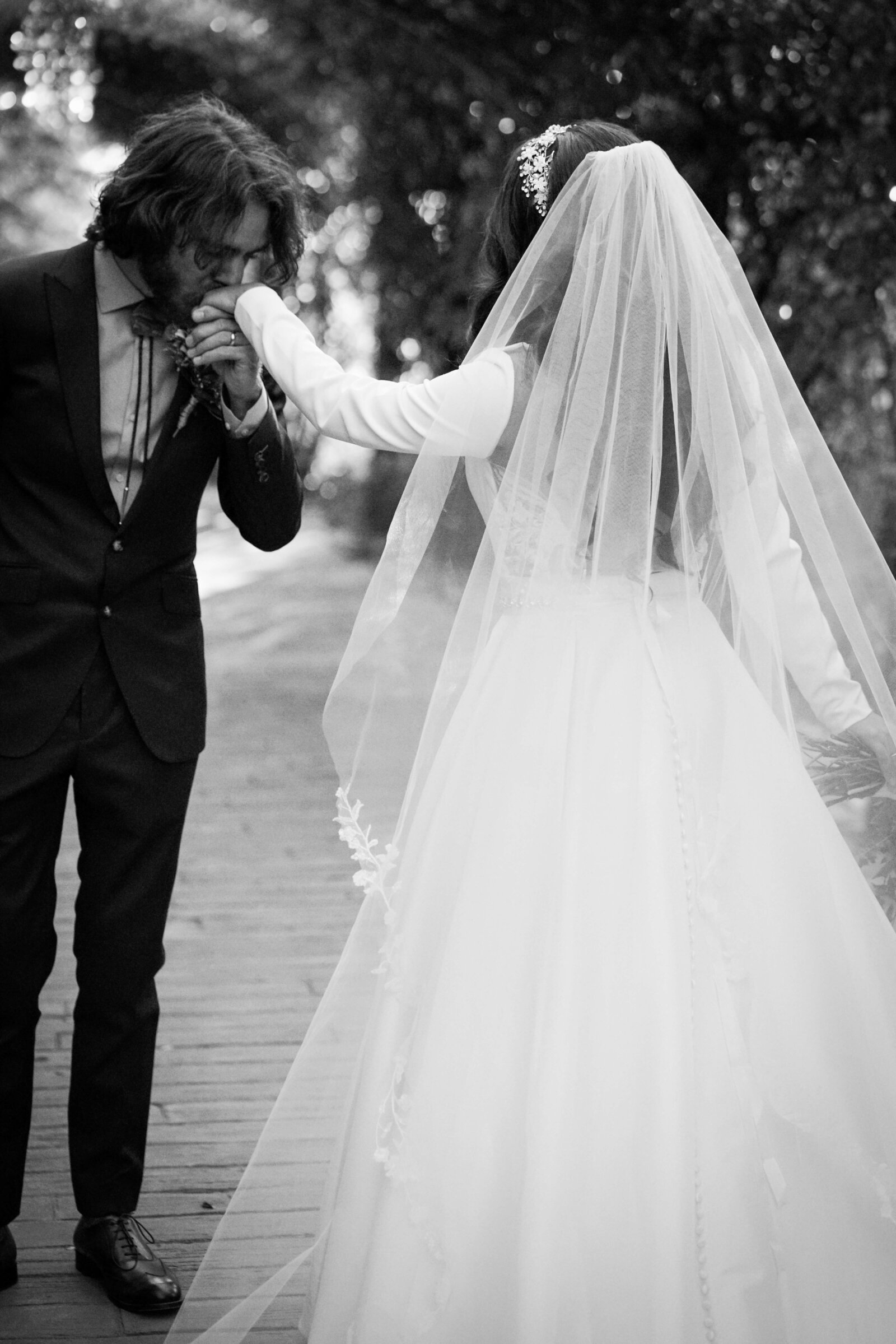 Newport Beach Wedding Photographer groom kissing bride's hand during first look