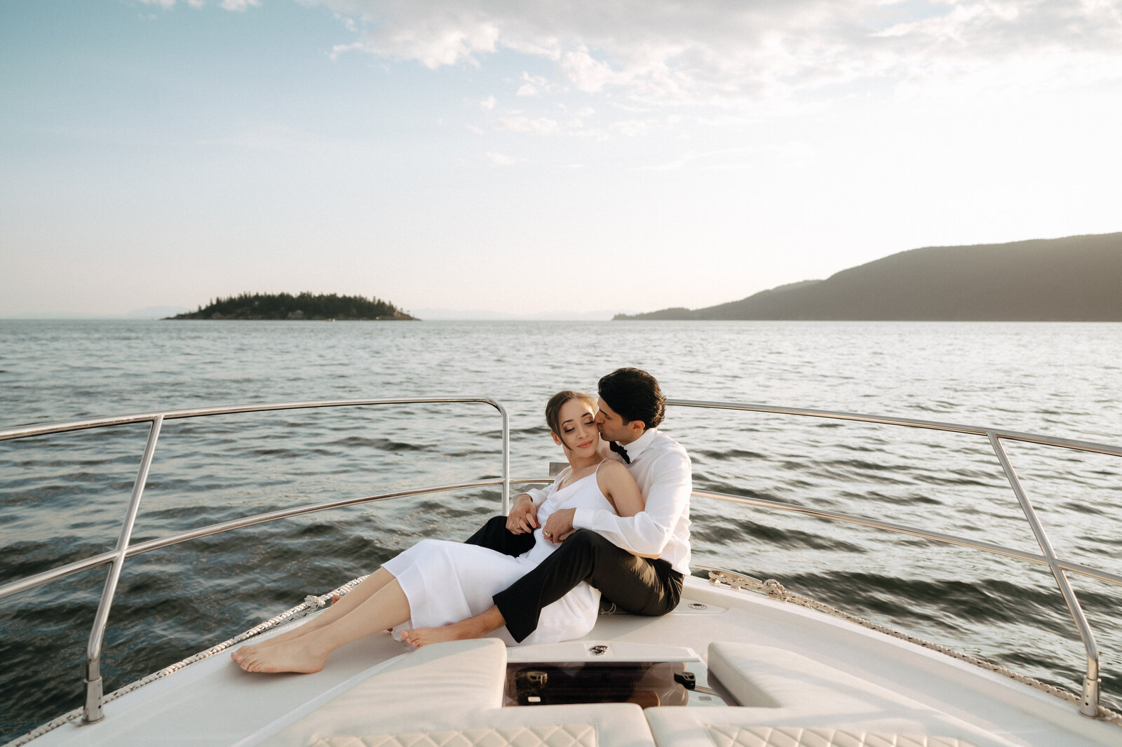 A couple on a boat during romantic Vancouver boating elopement package at sea