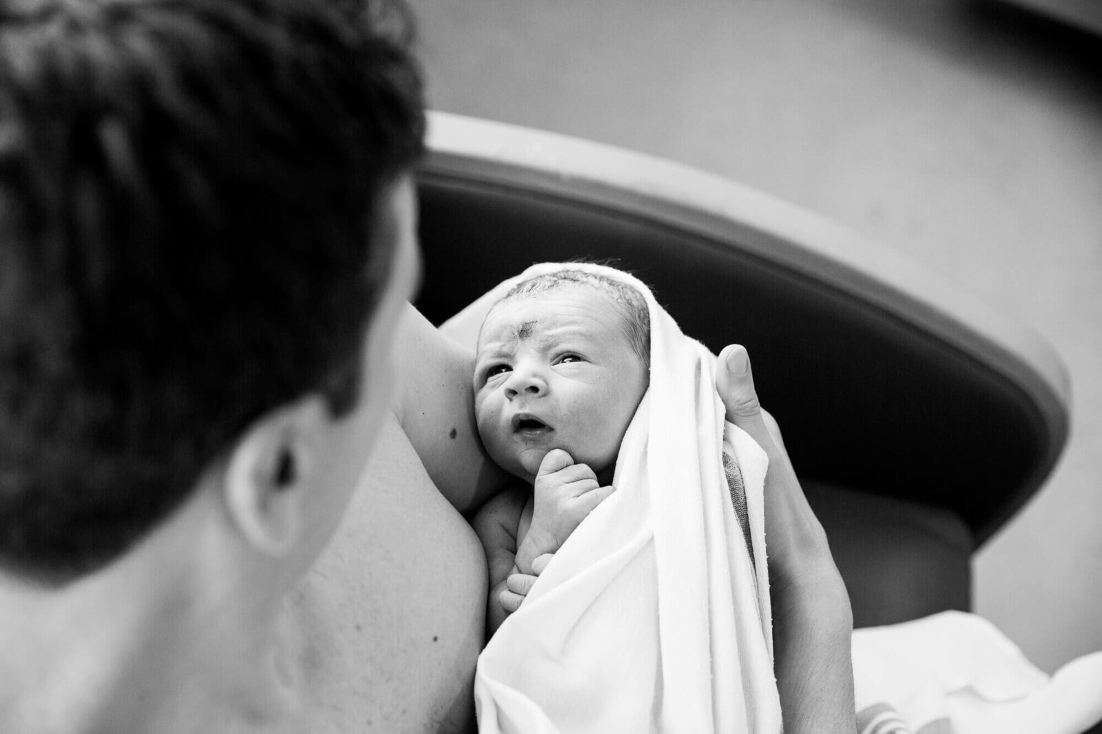 london-ontario-birth-photography-newborn-gazing-at-dad