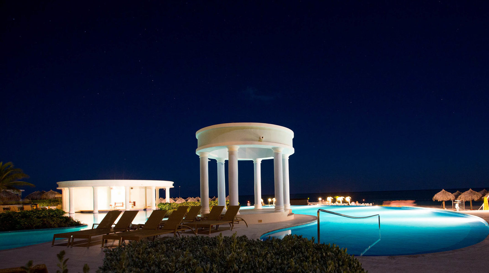 Jamaican Resort pool and gazebo at night