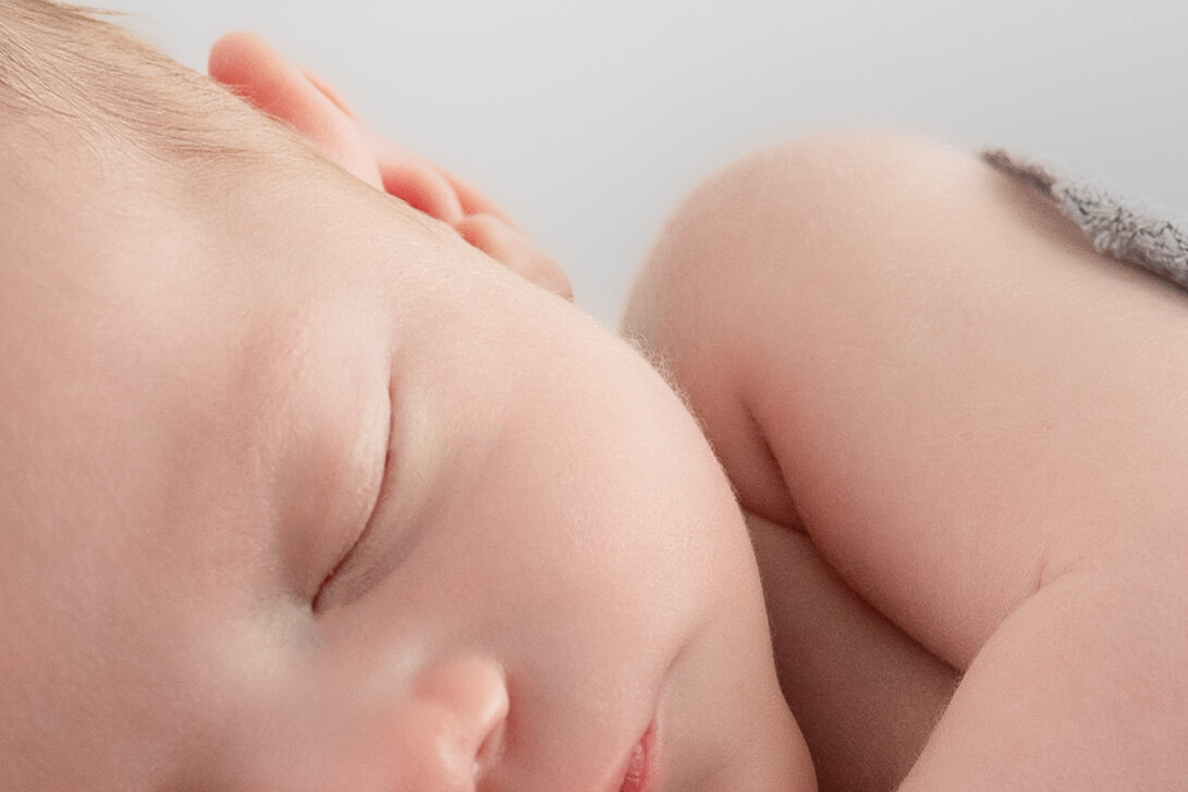 A closeup photo of a newborn baby sleeping for a photoshoot in Huntsville Alabama