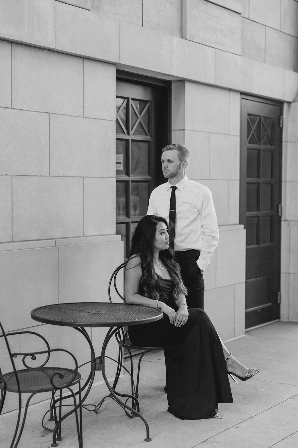 Couple sits at tables under arch at Millenium Gate in Georgia