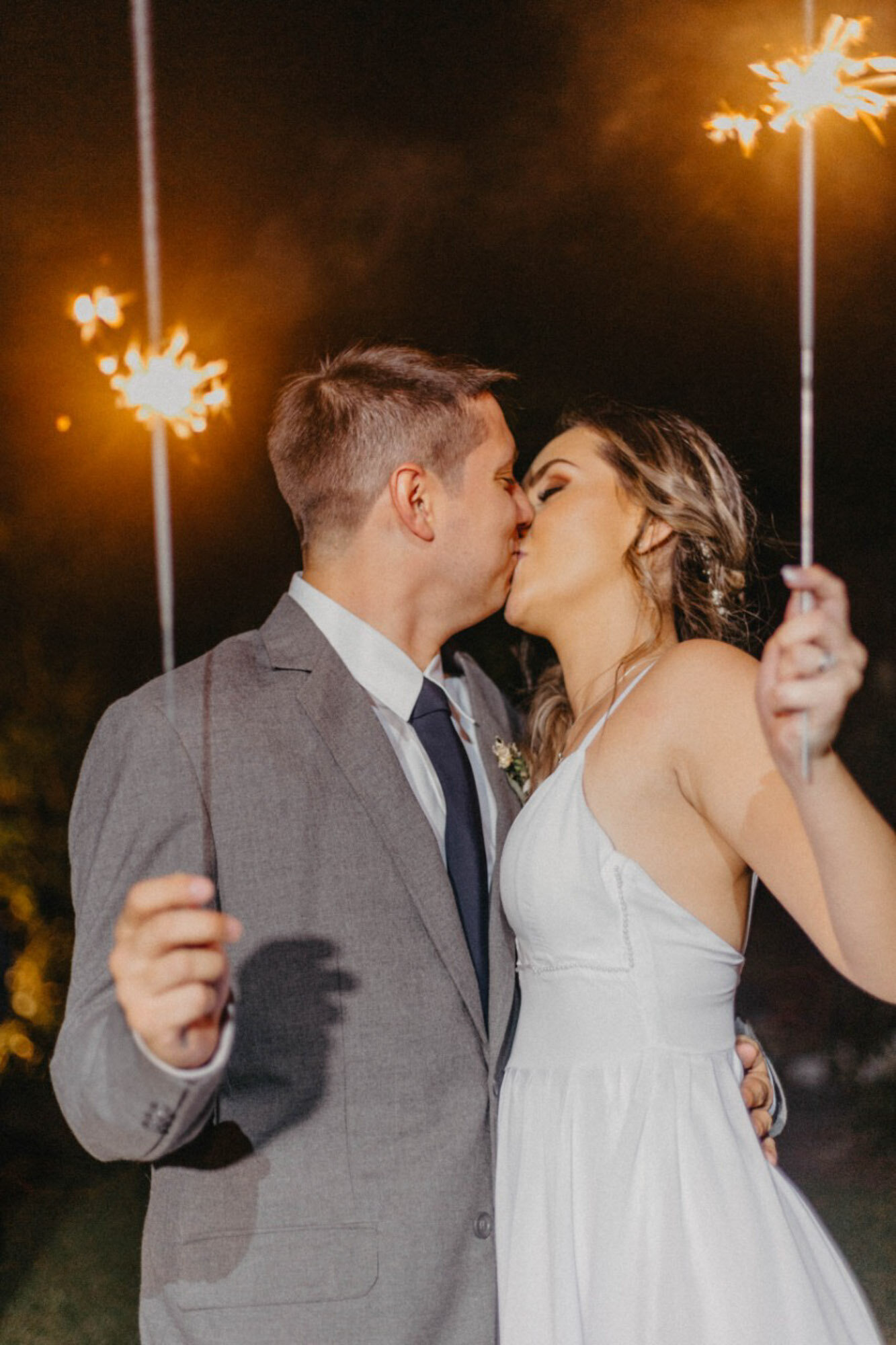 couple holding sparklers in costa rica