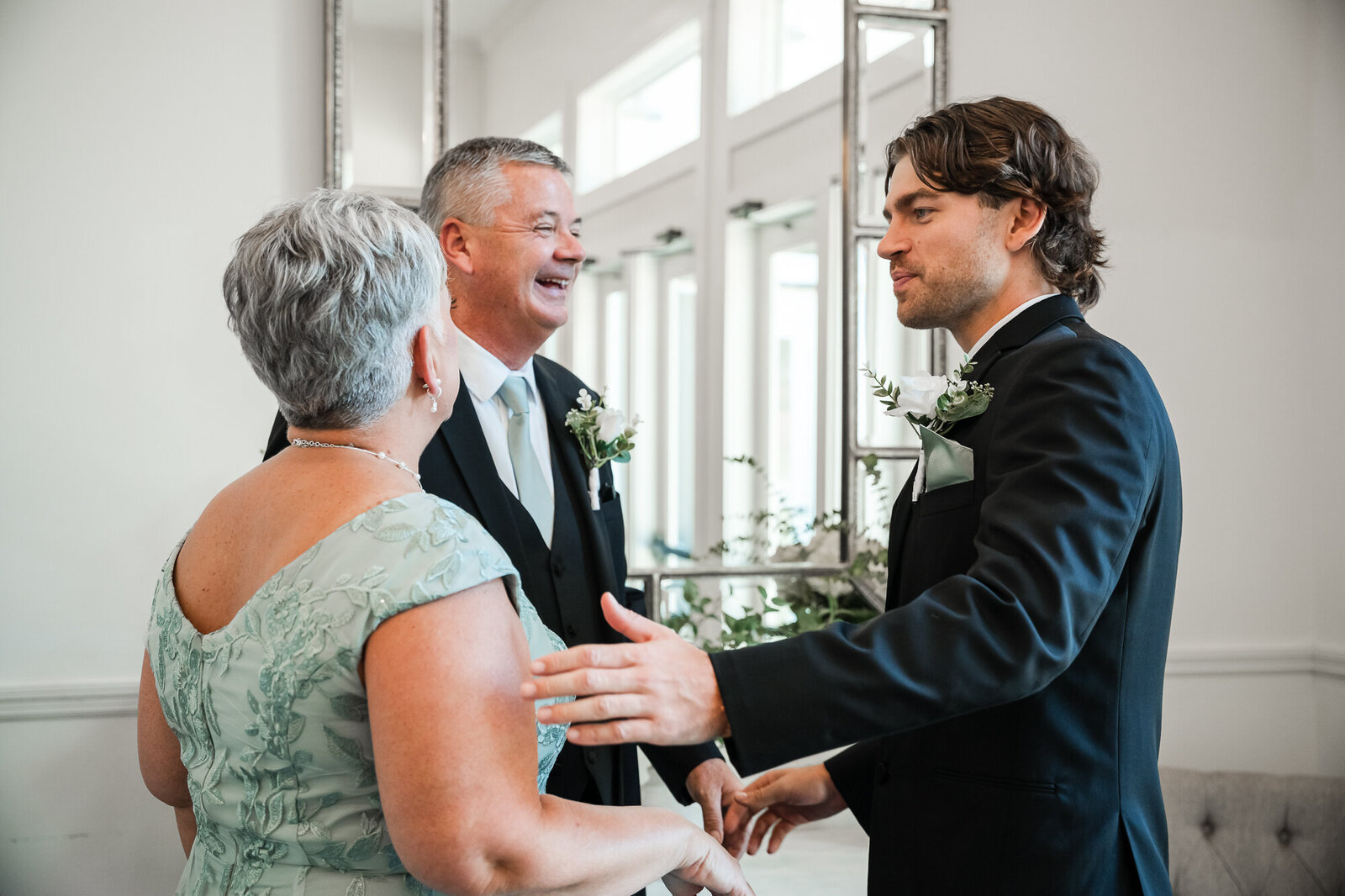 Groom and his parents right before the wedding ceremony at this beautiful Georgia Wedding venue in Lafayette GA 