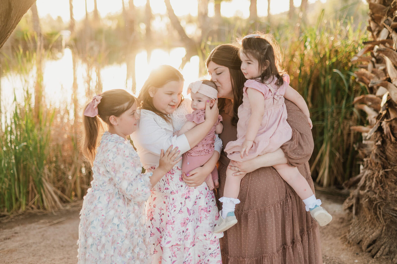 Mom hugs her four daughters during sunset at Papago Park