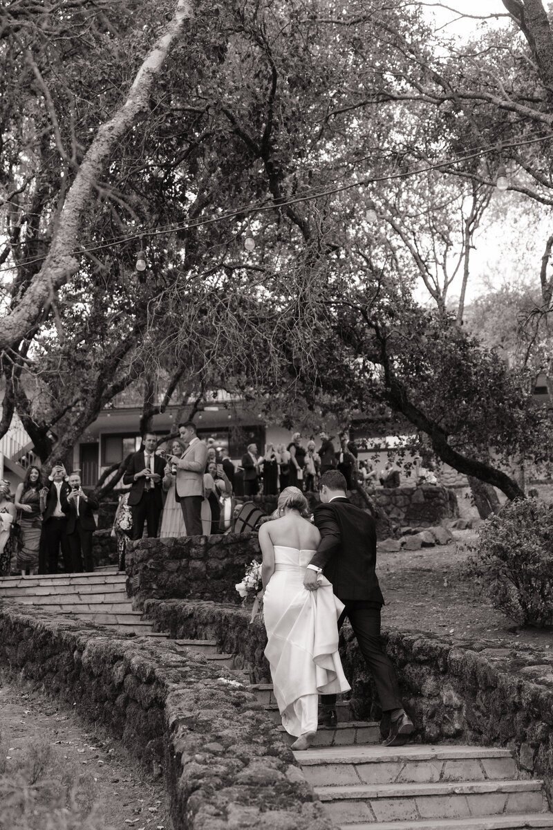 Bride and groom walking by best washington elopement photographer
