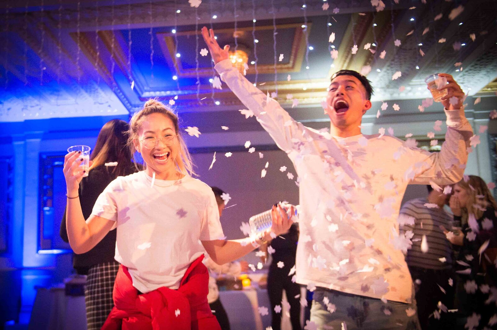 Holiday party. People dancing excitedly in confetti.-2018