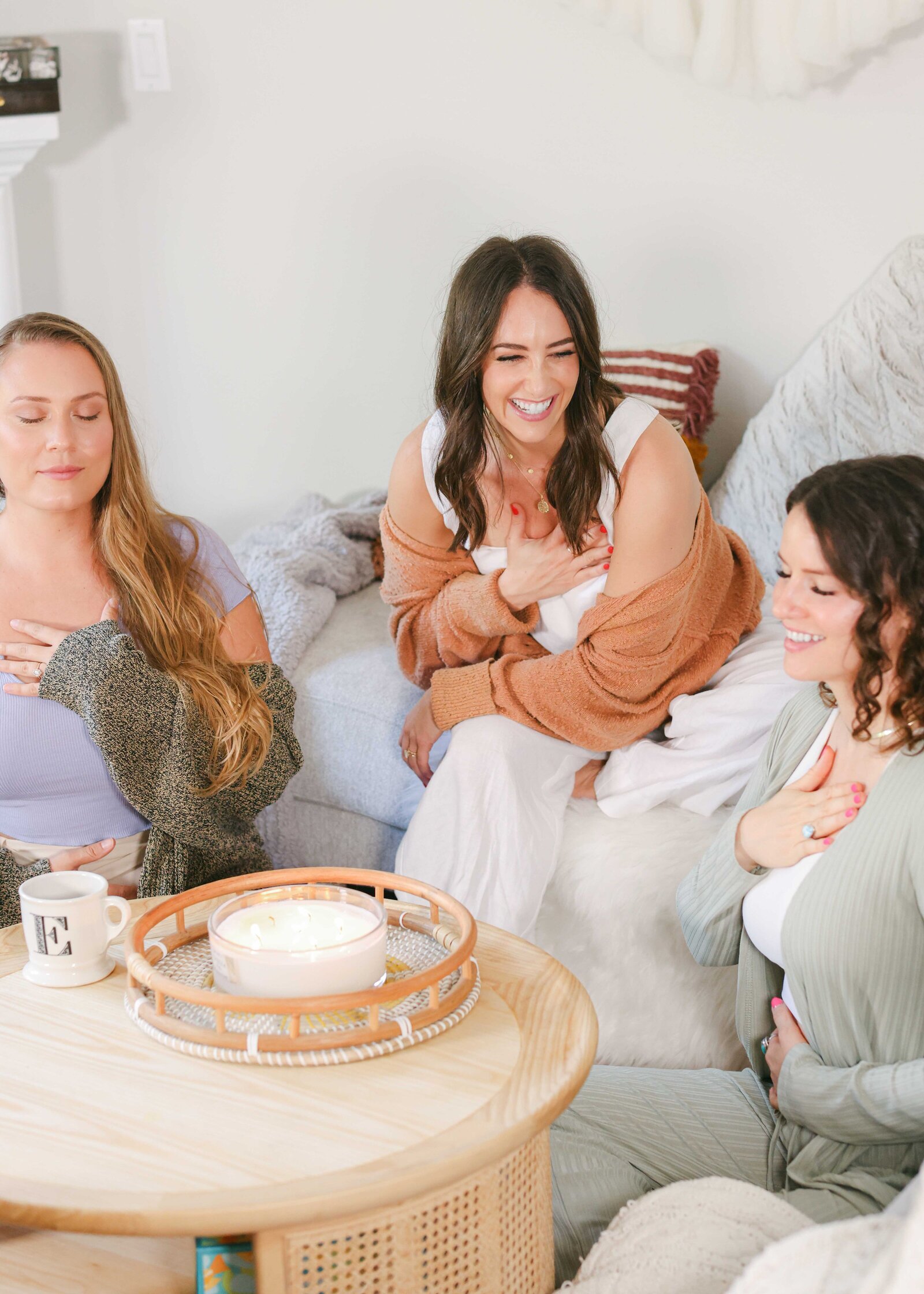women sitting around in a circle at a cozy retreat photoshoot
