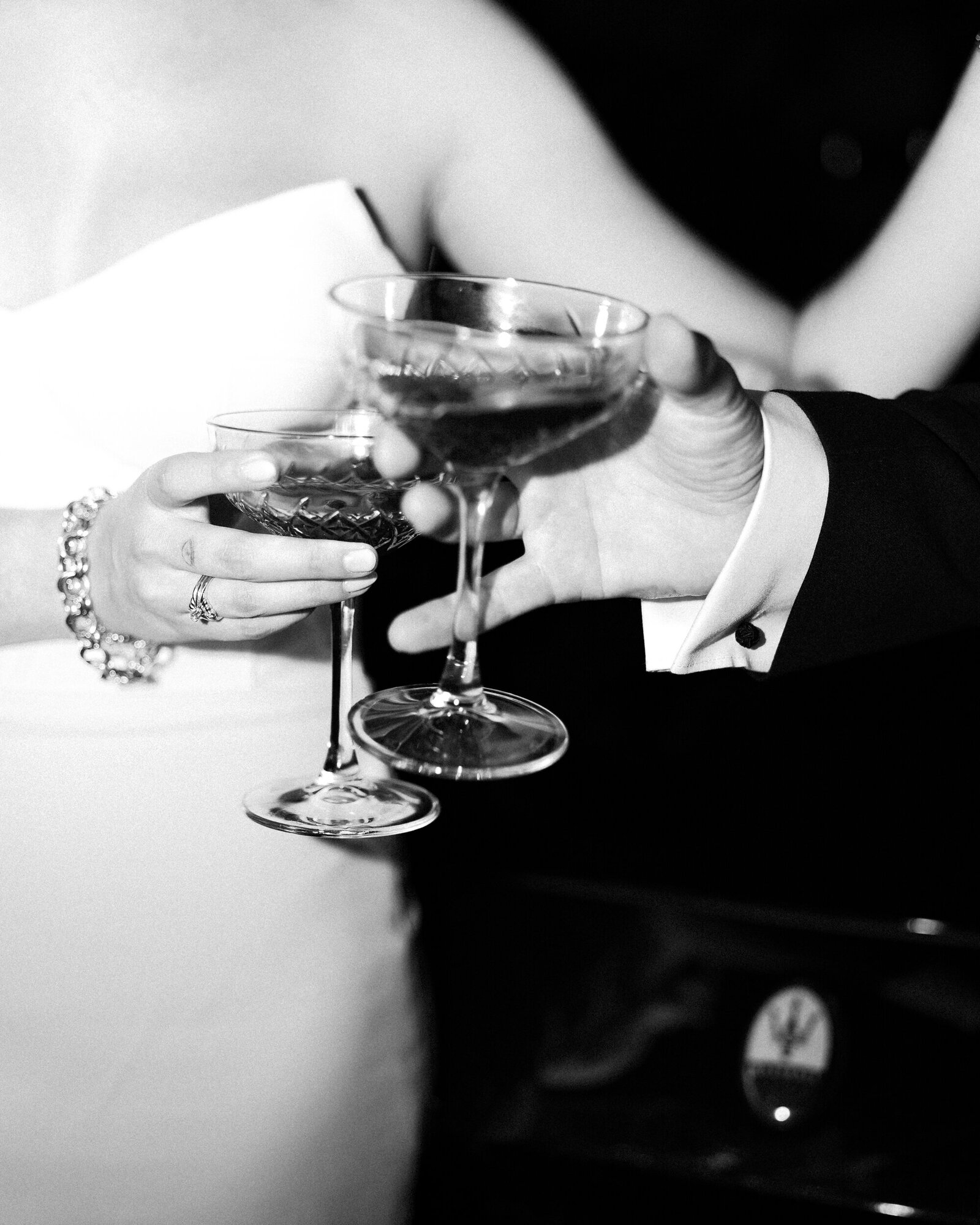 Black and white photo of couple drinking specialty wedding cocktails at their reception | Megan Smith Photo