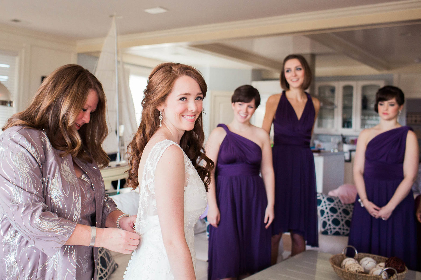 Bride gets into dress, Isle of Palms, Charleston, South Carolina