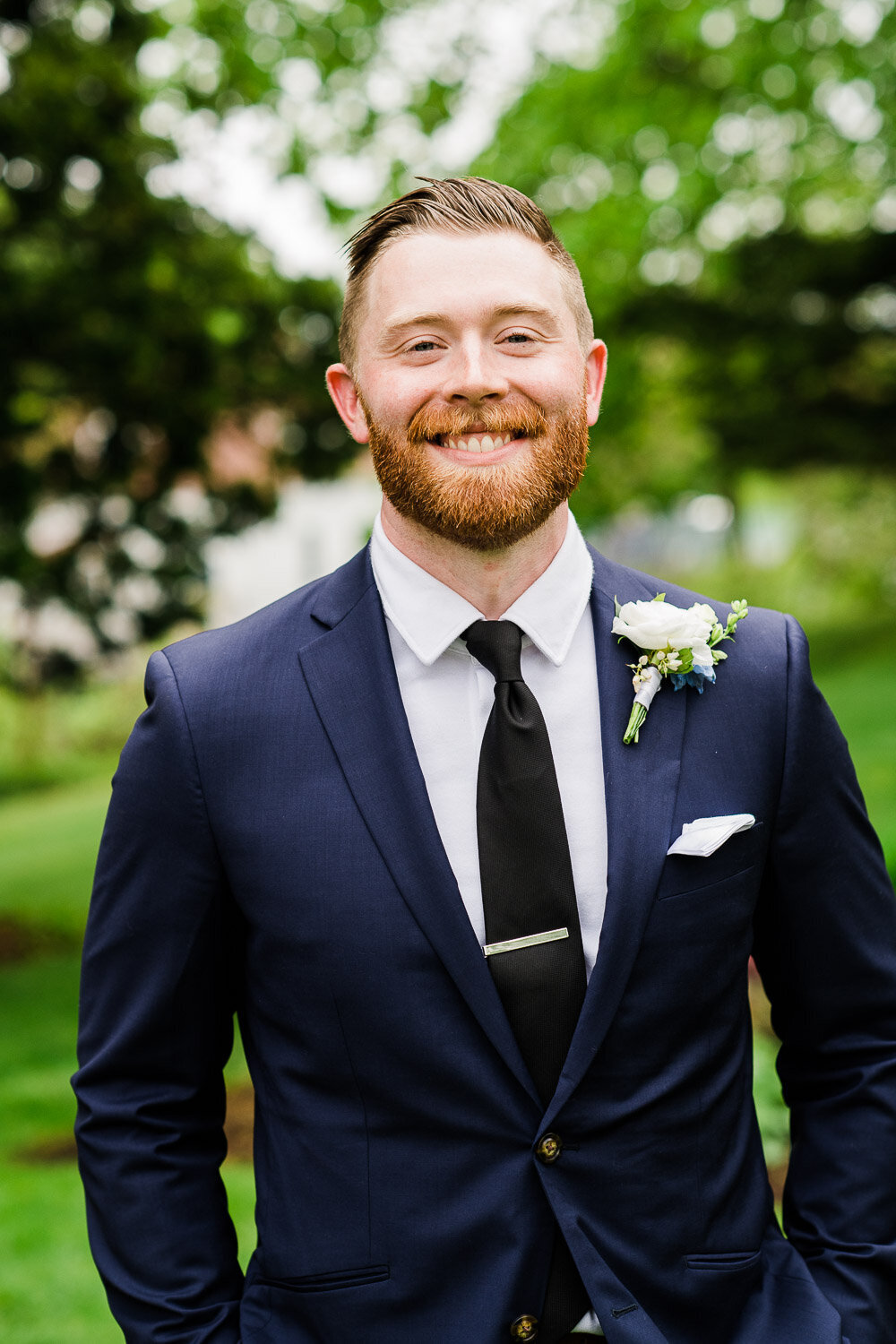 groom portrait smiling