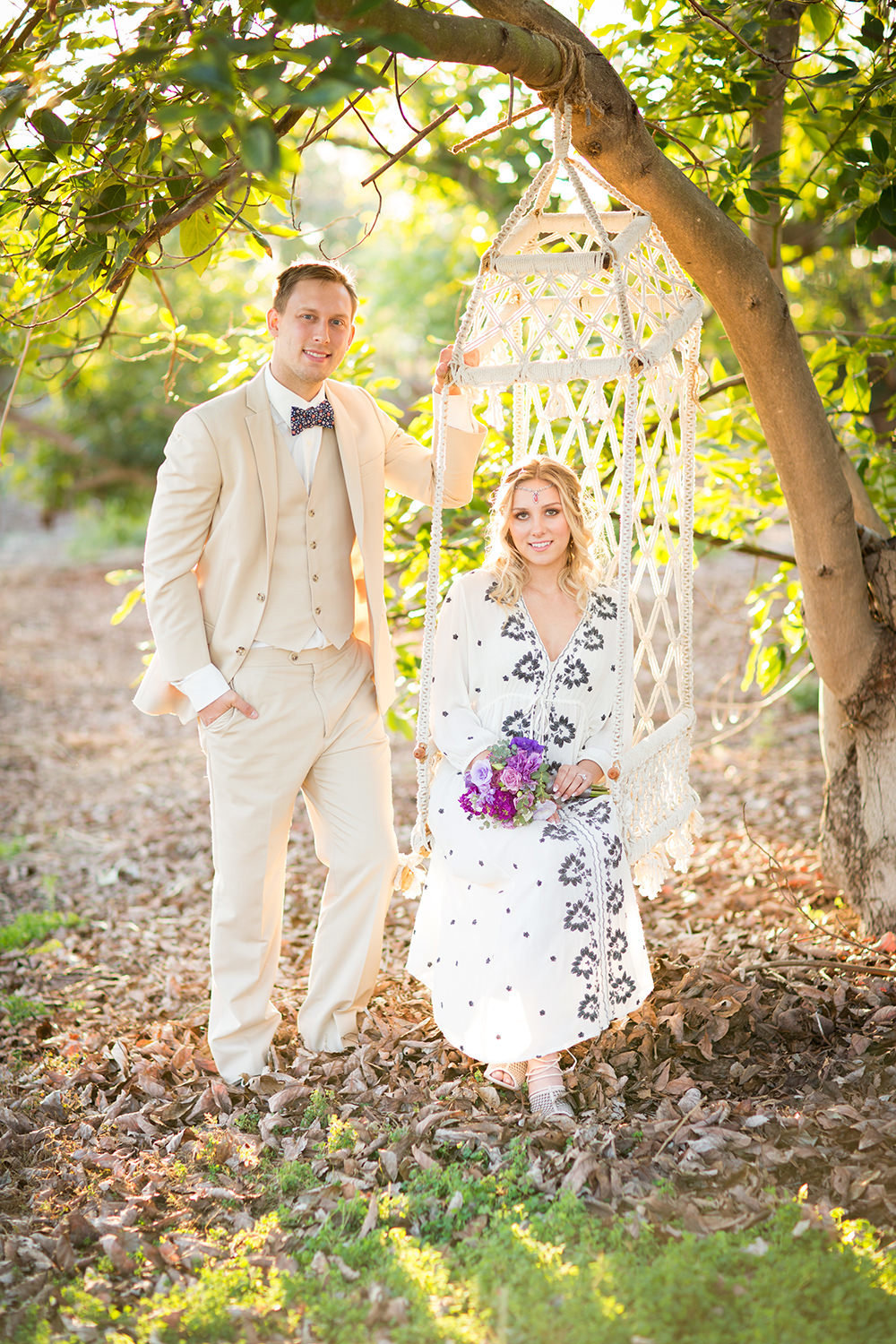 rustic swing with bride and groom
