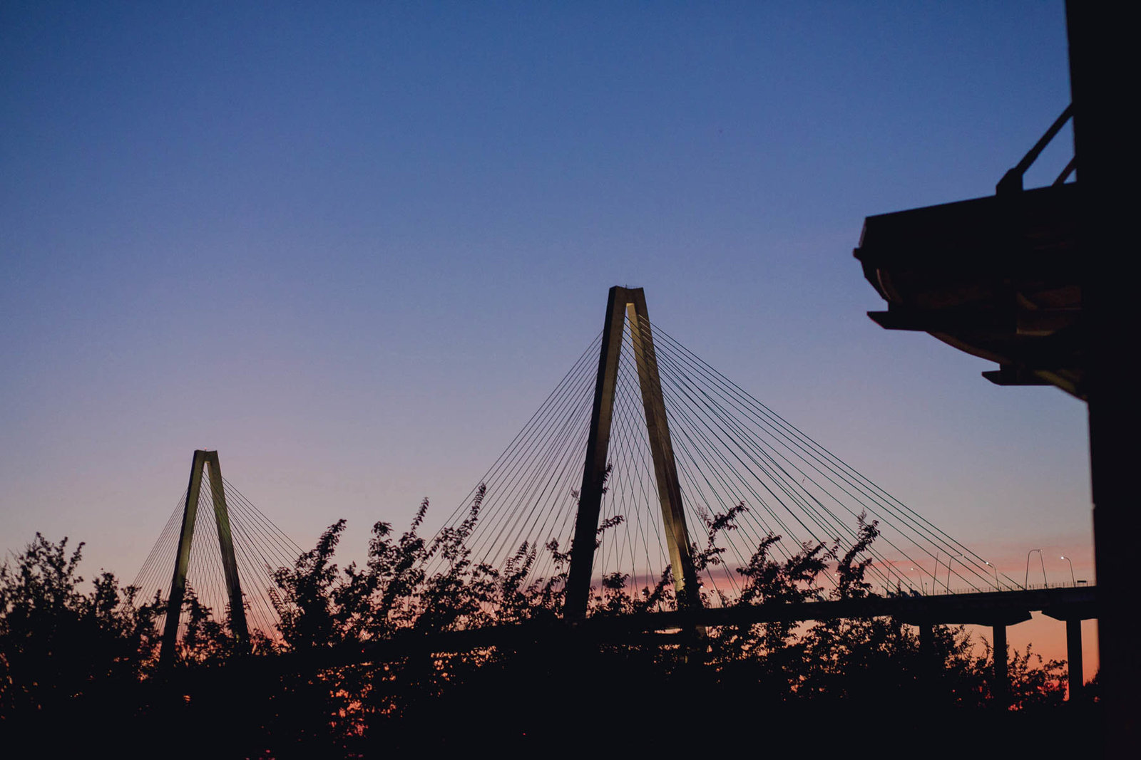 Ravenel bridge is silhouetted at sunset, Harborside East, Mt Pleasant, South Carolina