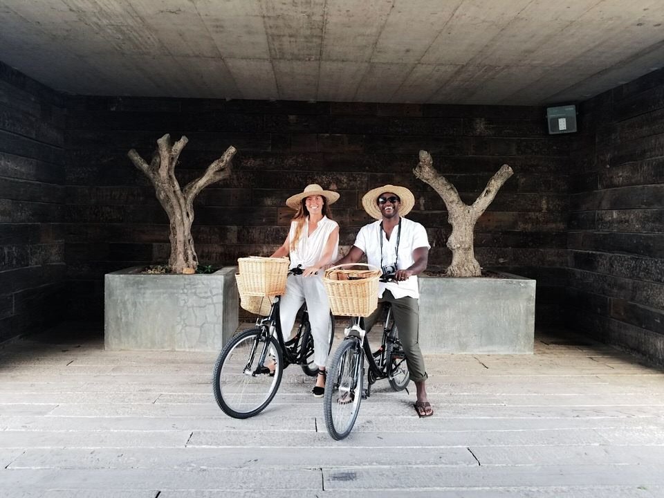 a couple on bikes on their honeymoon in portugal