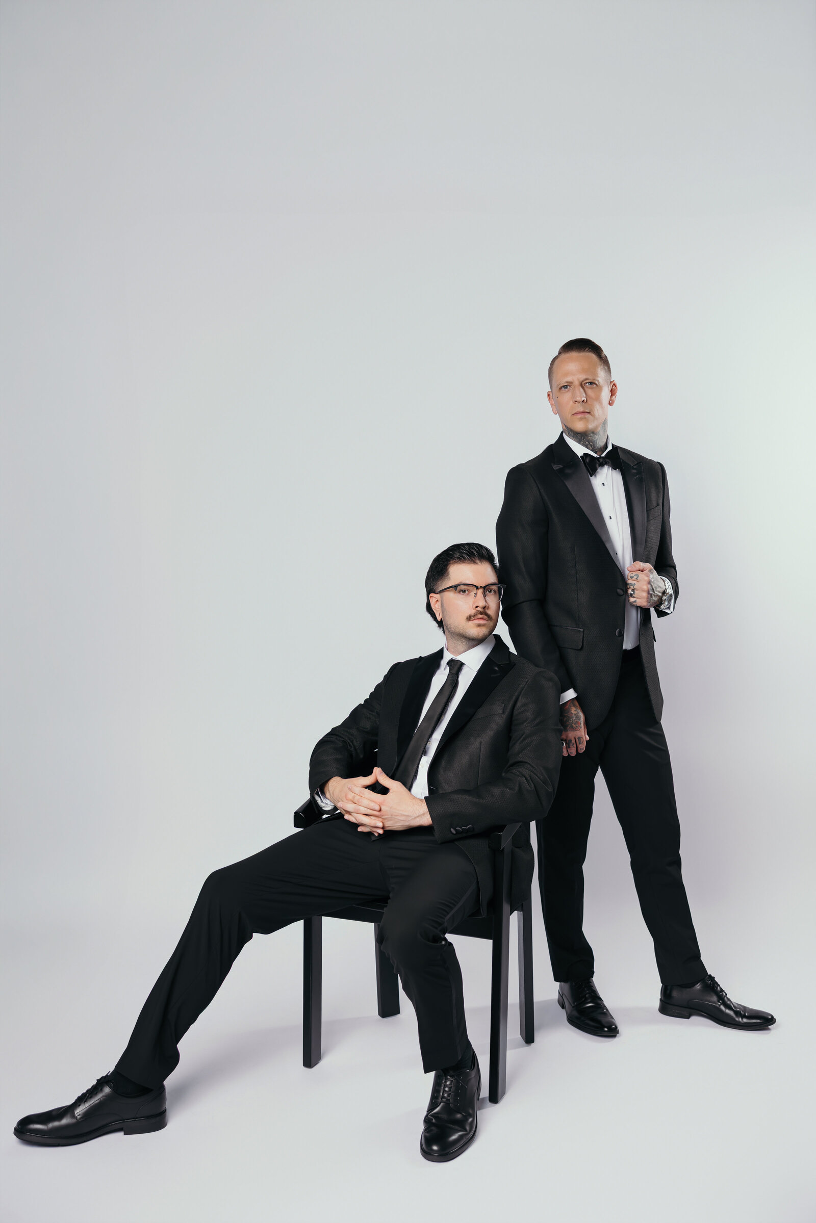 Editorial-style team portrait of The Proper Collective — luxury wedding film & photo creators in Des Moines.