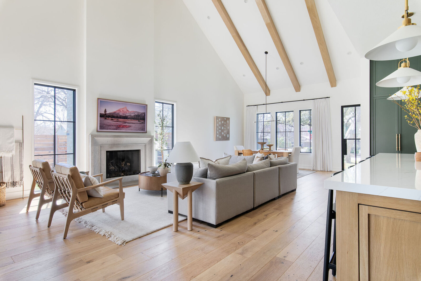 Neutral Living Room with wood ceiling beams_Nuela+Designs